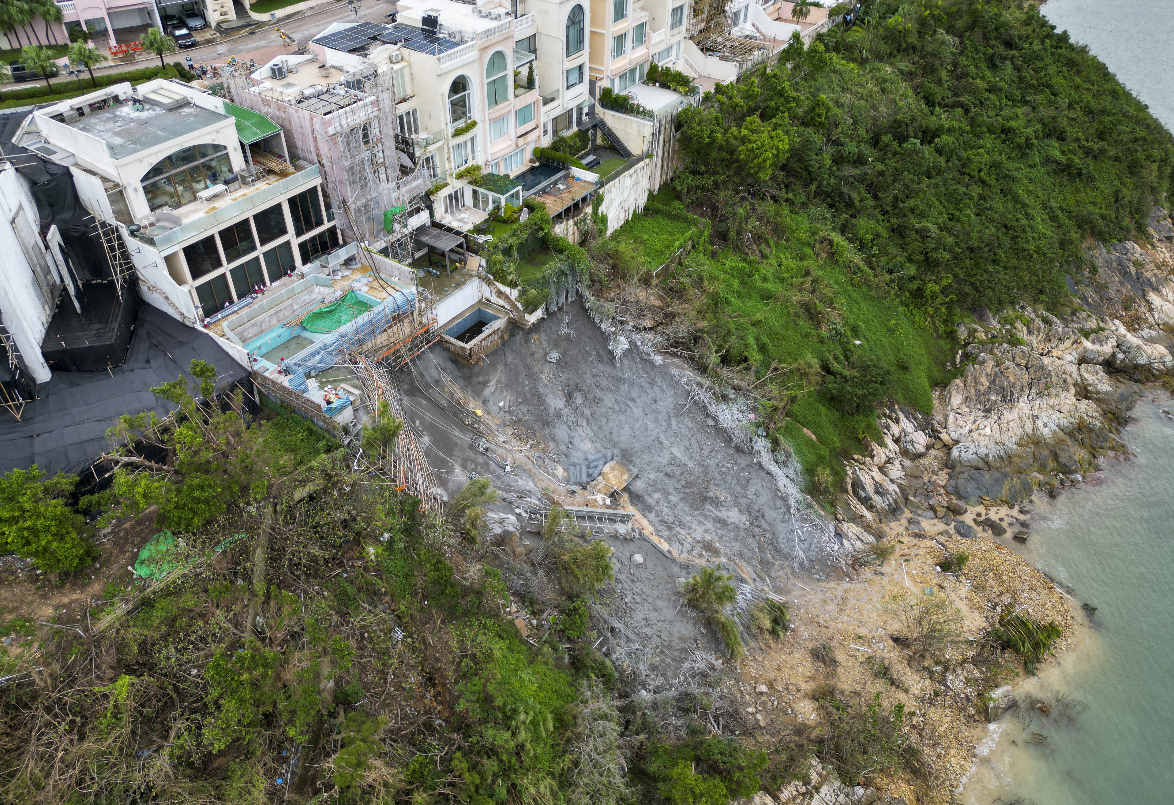 Workers making emergency repairs as Redhill Peninsula in Tai Tam inspected after major landslide. Photo: Dickson Lee