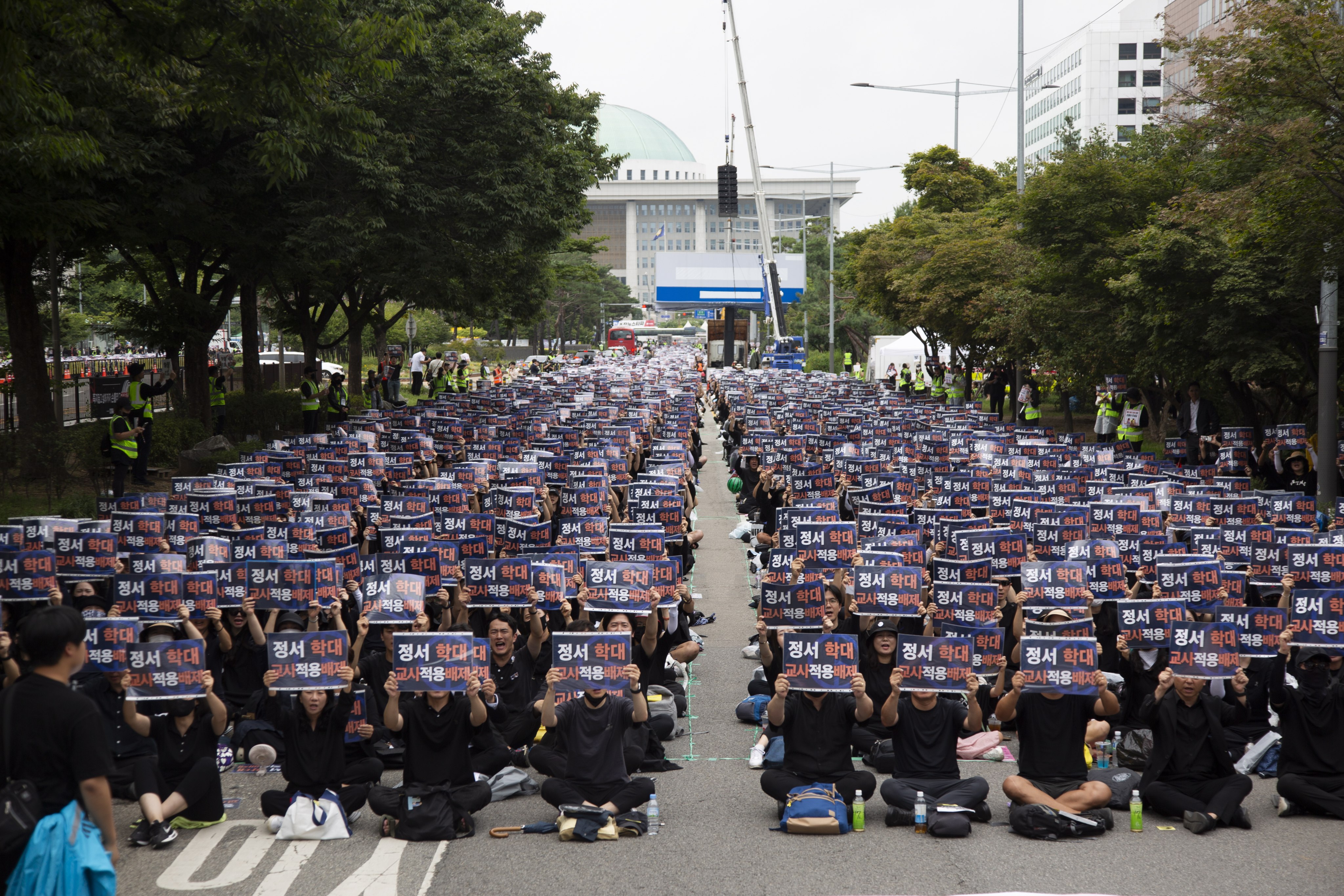 South Korean teachers at a rally against the government’s education policy outside the National Assembly in Seoul. The protesting teachers, who have rallied for weeks, say current laws make it difficult to exercise control over their classrooms and leave them at the mercy of overbearing parents. Photo: EPA-EFE