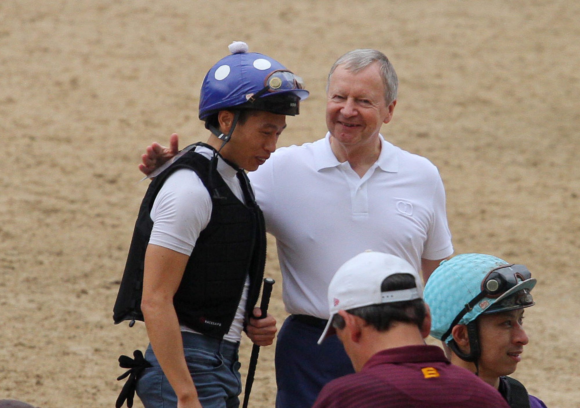 Jockey Club chief executive Winfried Engelbrecht-Bresges welcomes jockey Vincent Ho back to trackwork on Saturday.