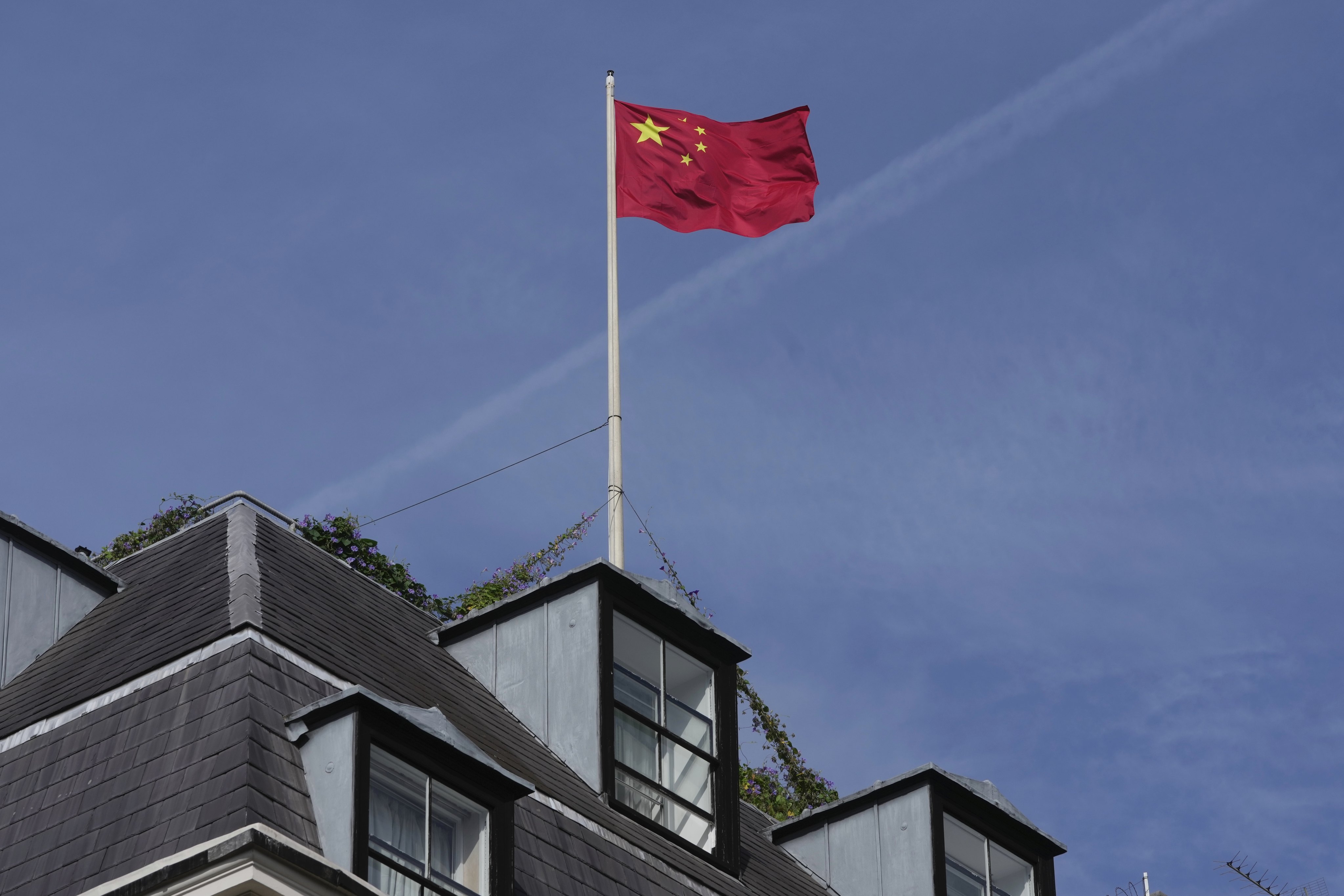 The national flag flies above the Chinese embassy in London on September 11. British Prime Minister Rishi Sunak has chastised China for what he called unacceptable interference in British democracy after a newspaper reported that a researcher in Parliament was arrested earlier this year on suspicion of spying for Beijing. Photo: AP