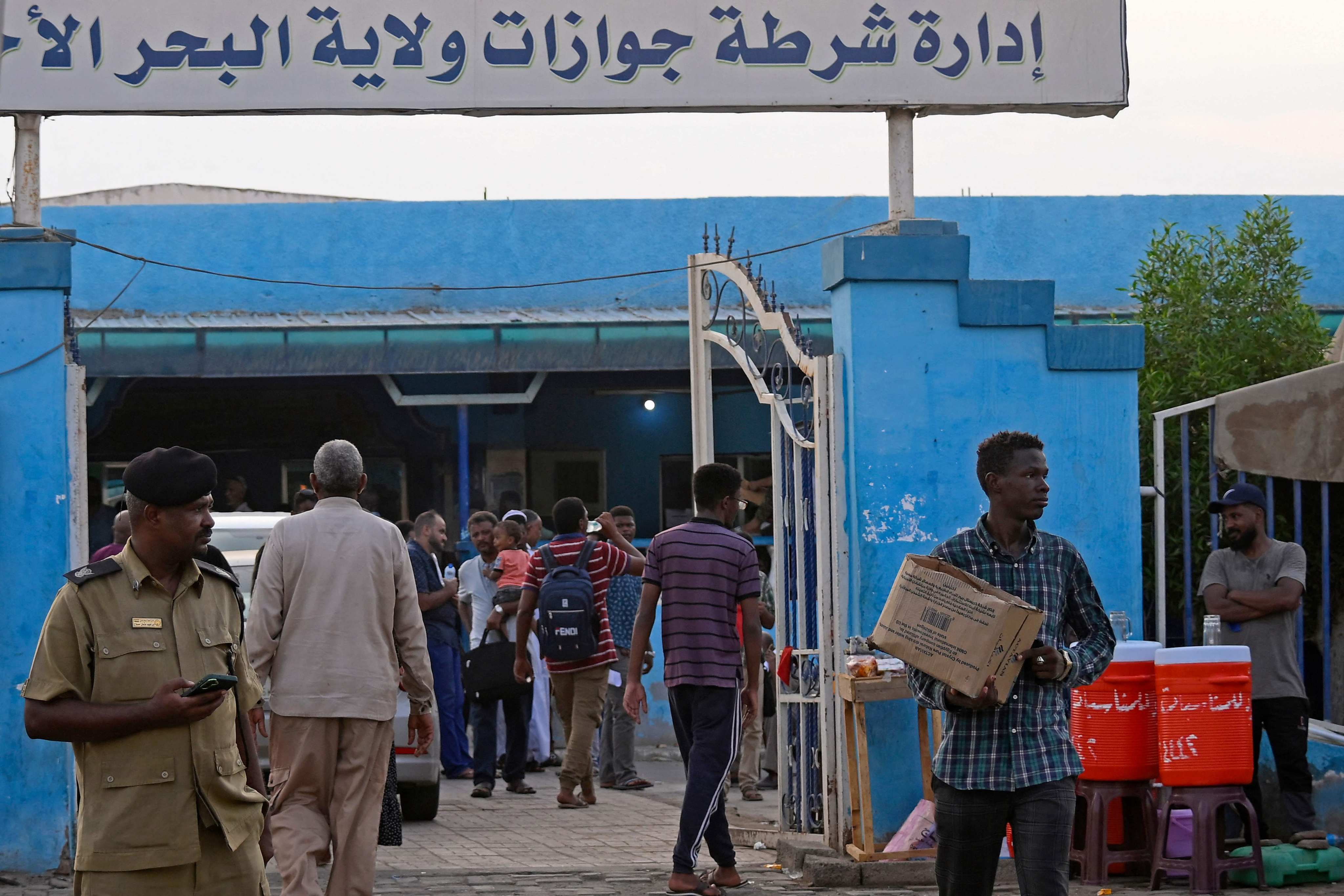 Sudanese wait at a Passports and Immigration Services office in Port Sudan on September 3. Photo: AFP