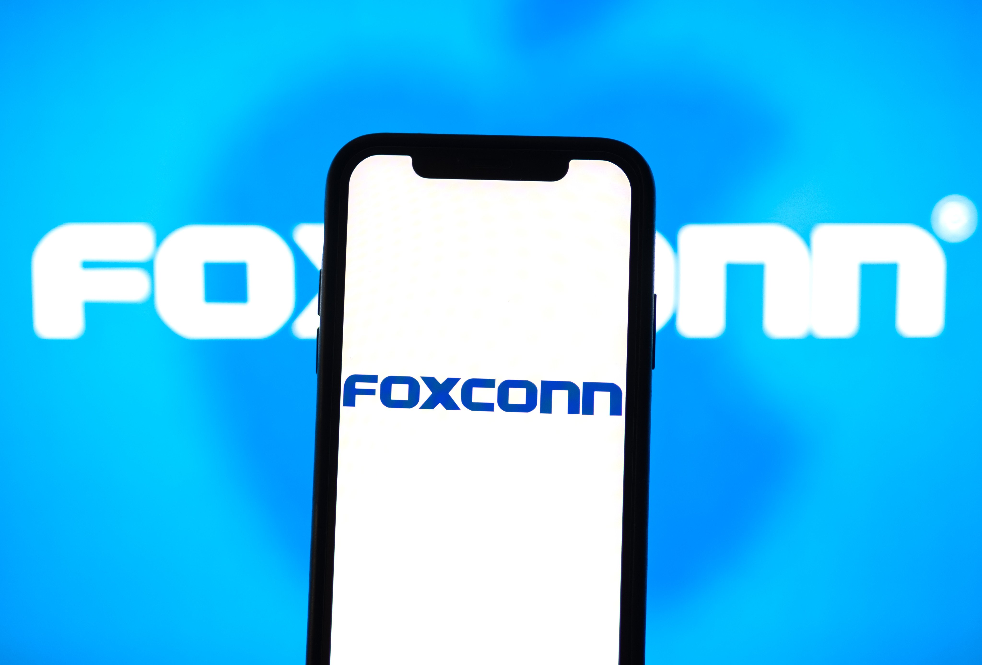 The Foxconn logo on a smartphone screen. Photo: Shutterstock