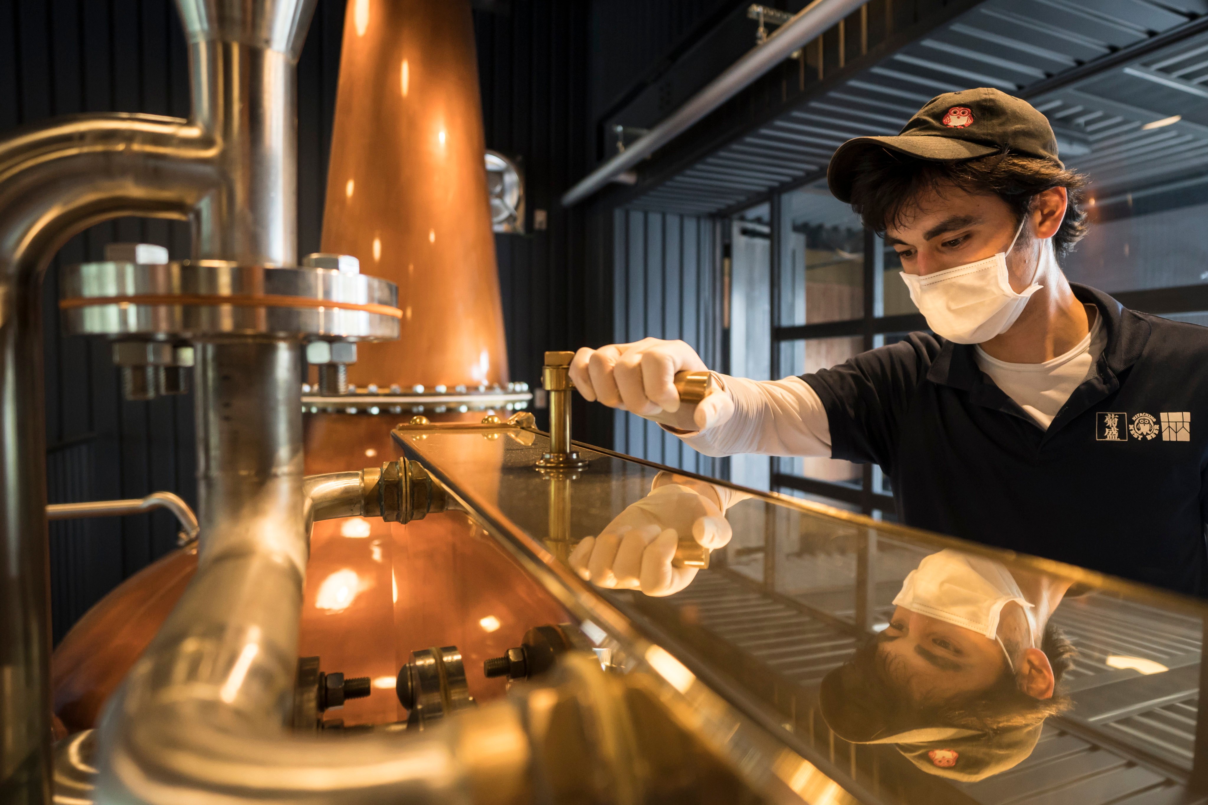 A distillery operator in Ishioka, Japan. Photo: Getty Images