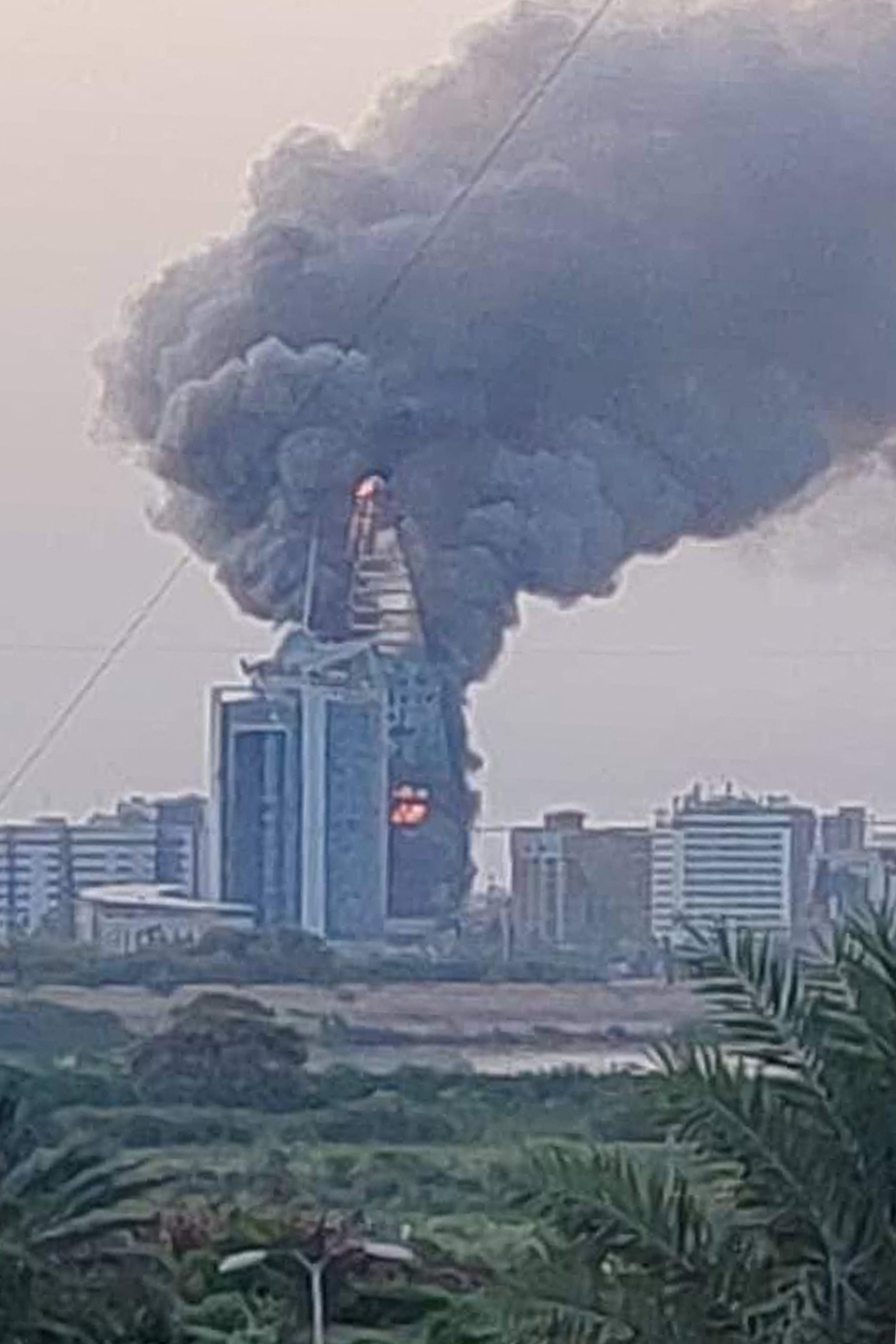 A fire raging at the Greater Nile Petroleum Oil Company Tower in Khartoum. Photo: AFP
