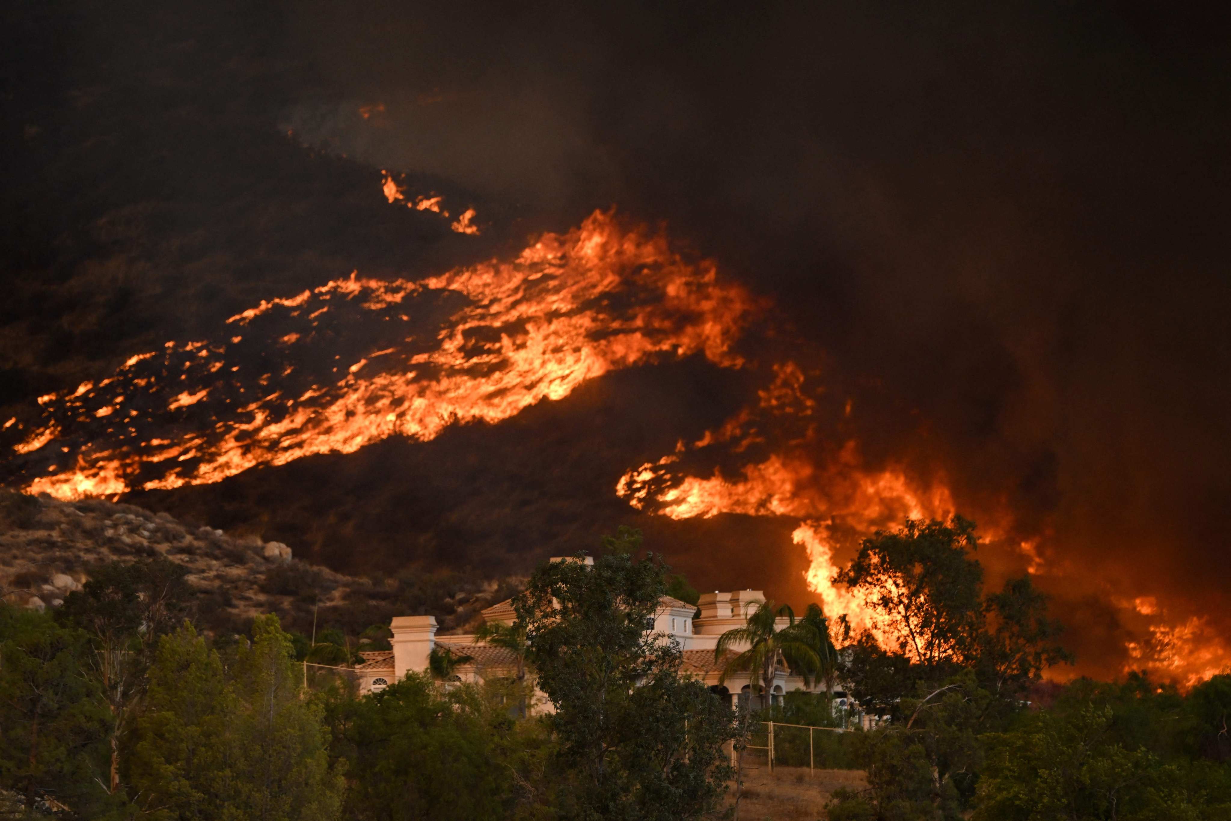 Plumes of smoke rise during a wildfire in California. Photo: AFP