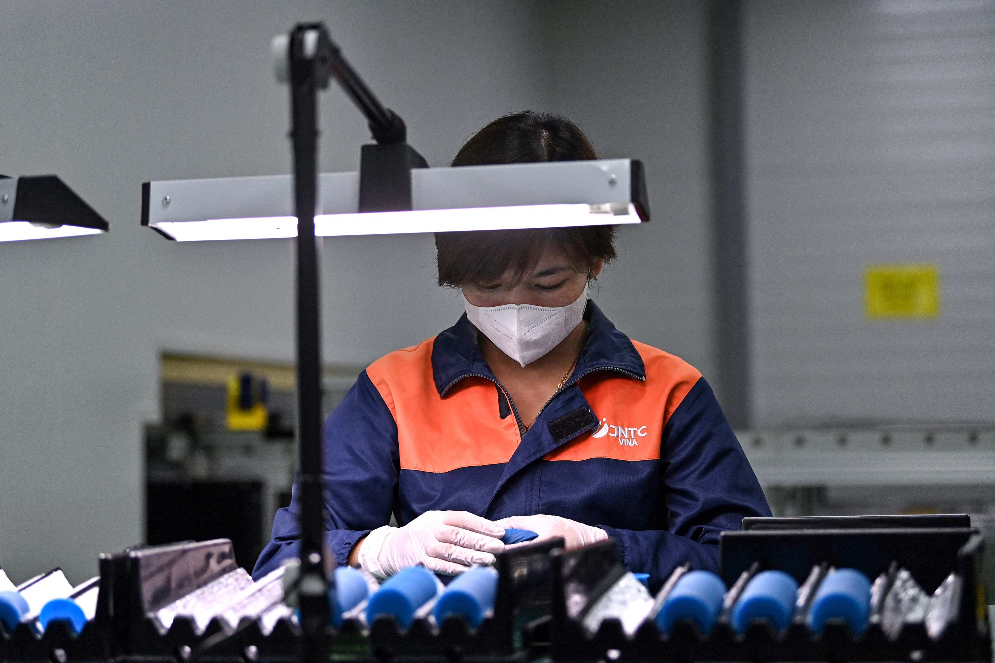 Vietnam’s relatively stable political environment and a young, low-cost workforce has long made it a manufacturing and export hub in the region. Photo: AFP
