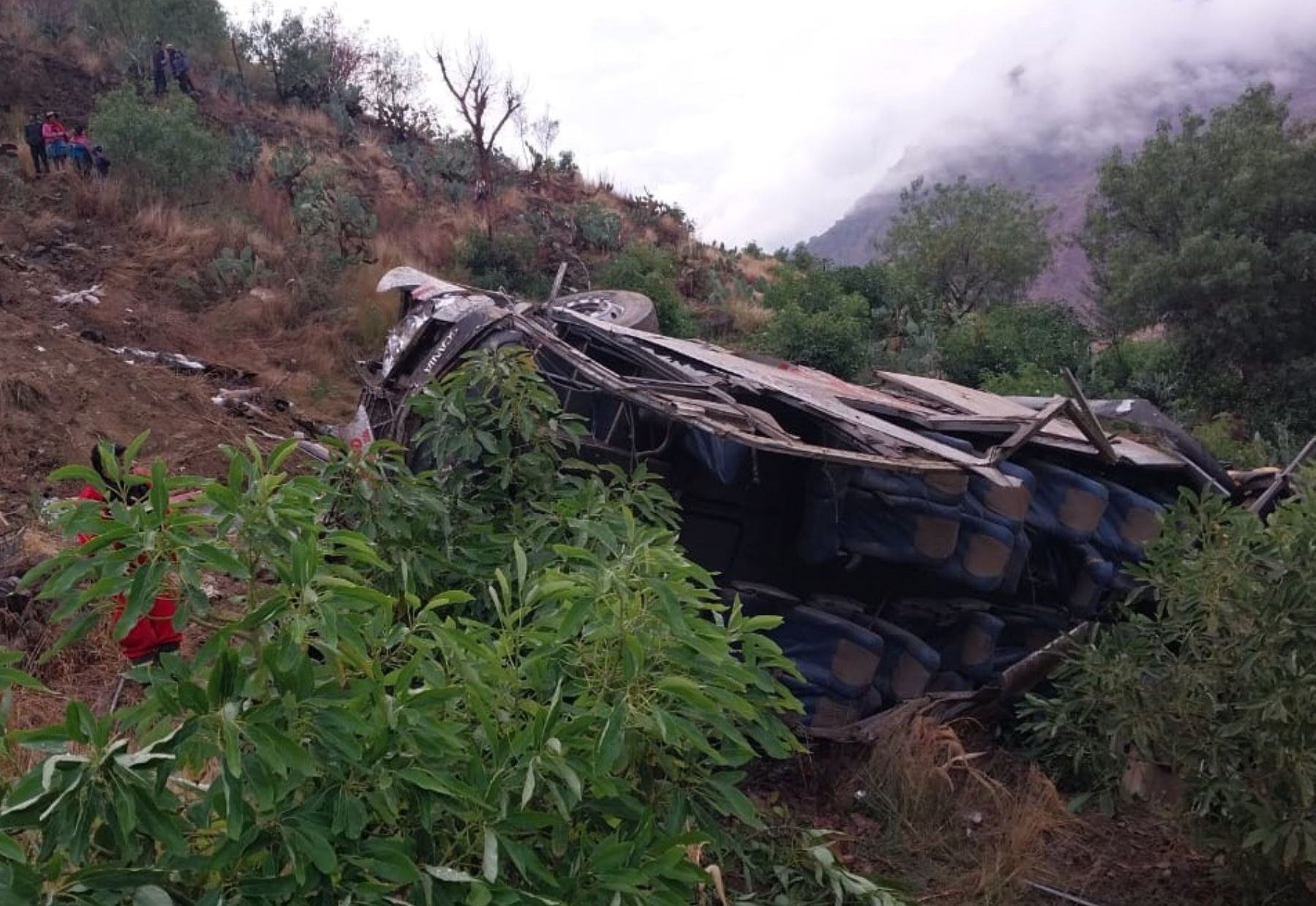The wreckage of a bus that fell into a ravine in Huaccoto, Churcampa province, Peru on Monday. Photo: EPA-EFE / Agencia Andina / Handout