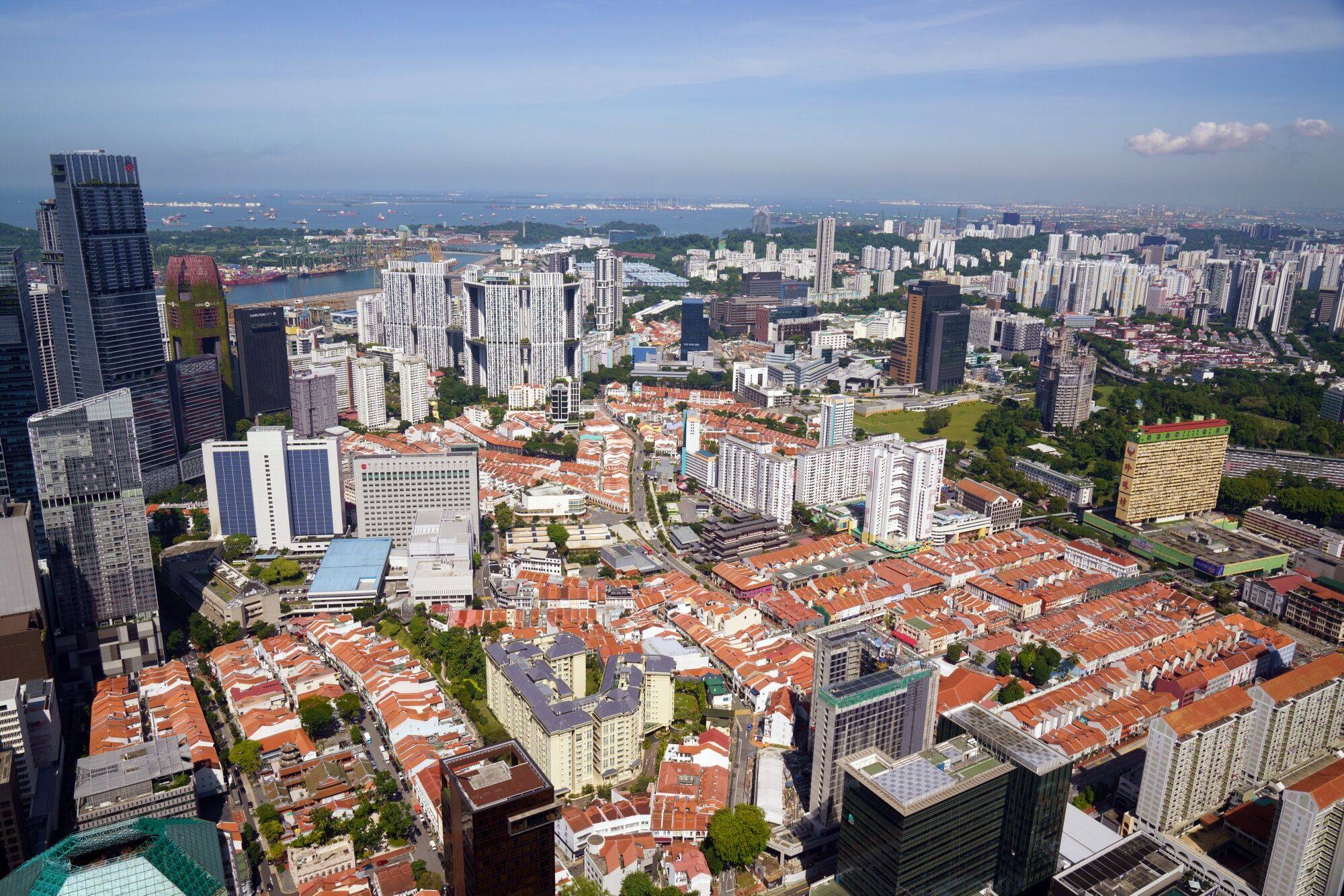 Residential and commercial buildings in Singapore. Rental growth across mass-market flats and high-end apartments has largely moderated in the city state, the latest data shows. Photo: Bloomberg
