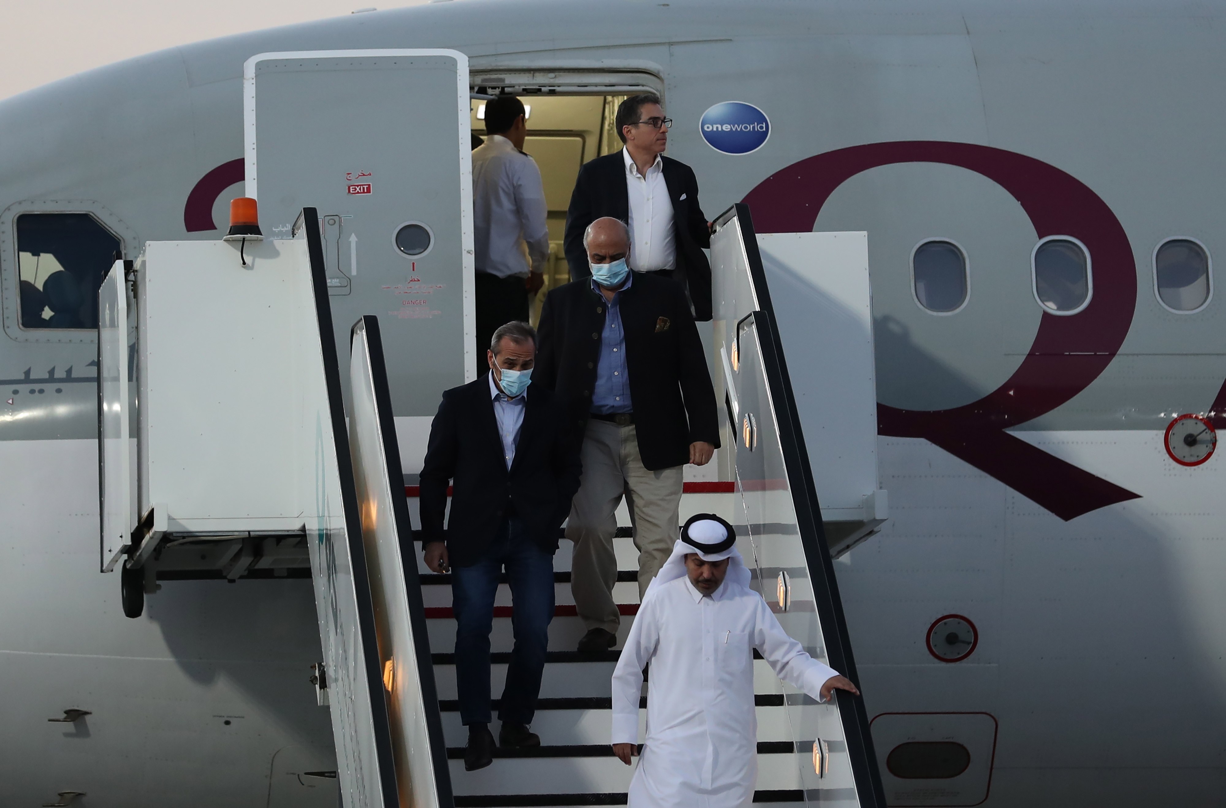 Siamak Namazi, Morad Tahbaz and Emad Shargi, who were released during a prisoner swap deal between the US and Iran, arrive at Doha International Airport, Qatar on Monday. Photo:
 EPA-EFE