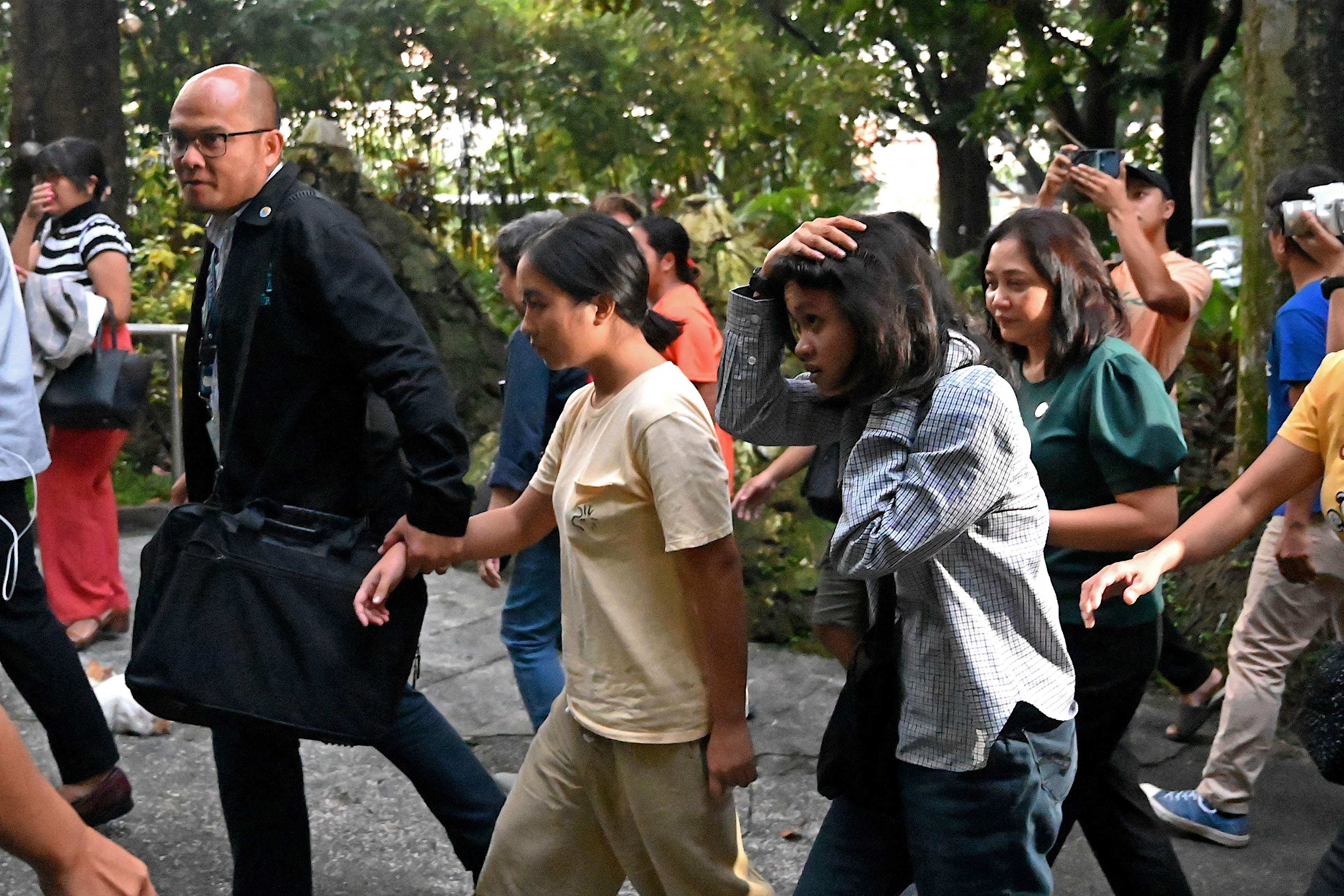 Jhed Tamano (centre, left) and Jonila Castro (centre, right) arrive to address a news conference at the Philippines’ Commission of Human Rights in Quezon City on Tuesday. Photo: AFP