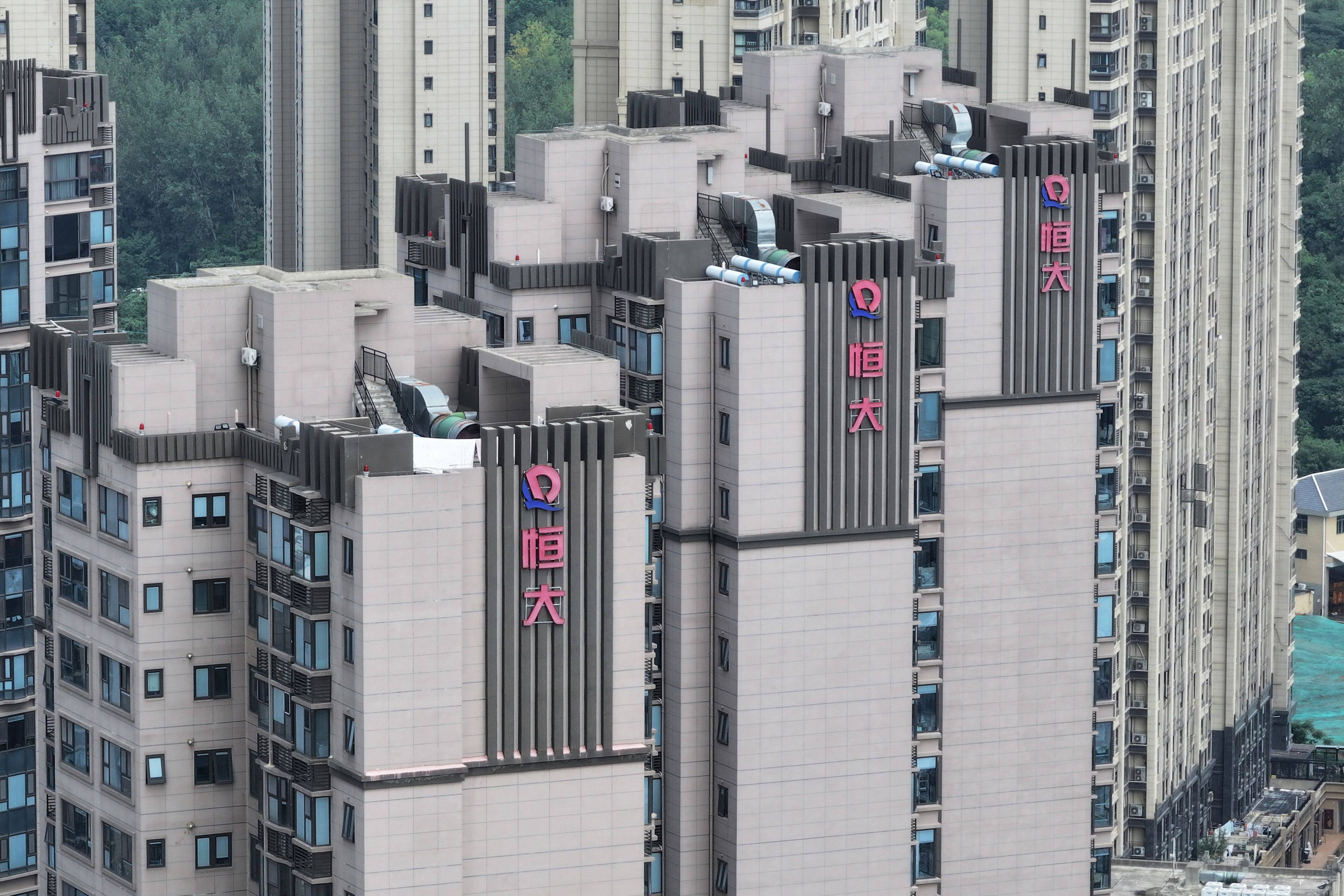 The Evergrande logo is seen on residential buildings in Nanjing, in China’s eastern Jiangsu province. The crisis at the developer’s wealth management arm comes at a time when the shadow banking industry in China has begun seeing increasing problems with repayments. Photo: AFP