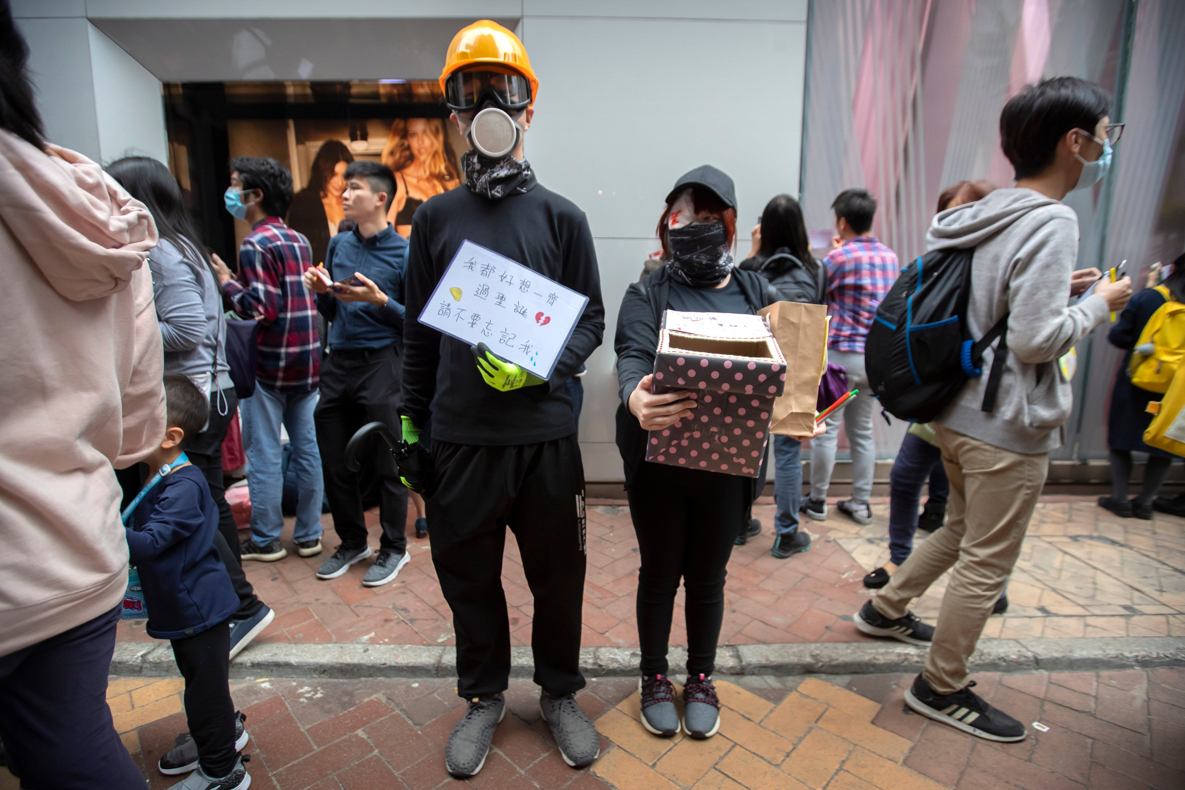 Protesters hold a box to collect Christmas cards for detained and jailed protesters during a rally in Hong Kong on December 16, 2019. Photo: AP
