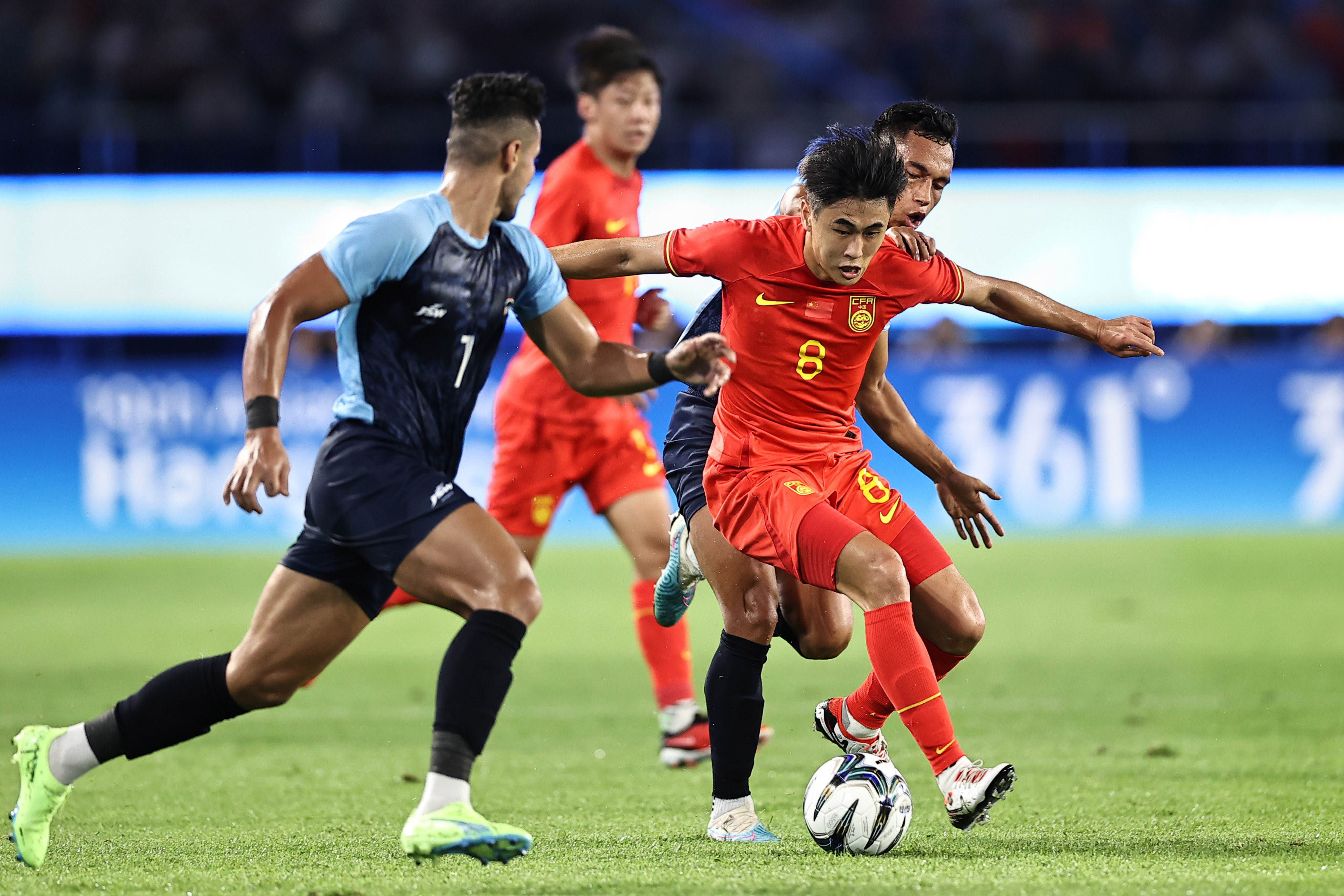 China’s Dai Wai-tsun drives through the India defence during his side’s Asian Games match at Huanglong Sports Centre Stadium. Photo: Getty Images