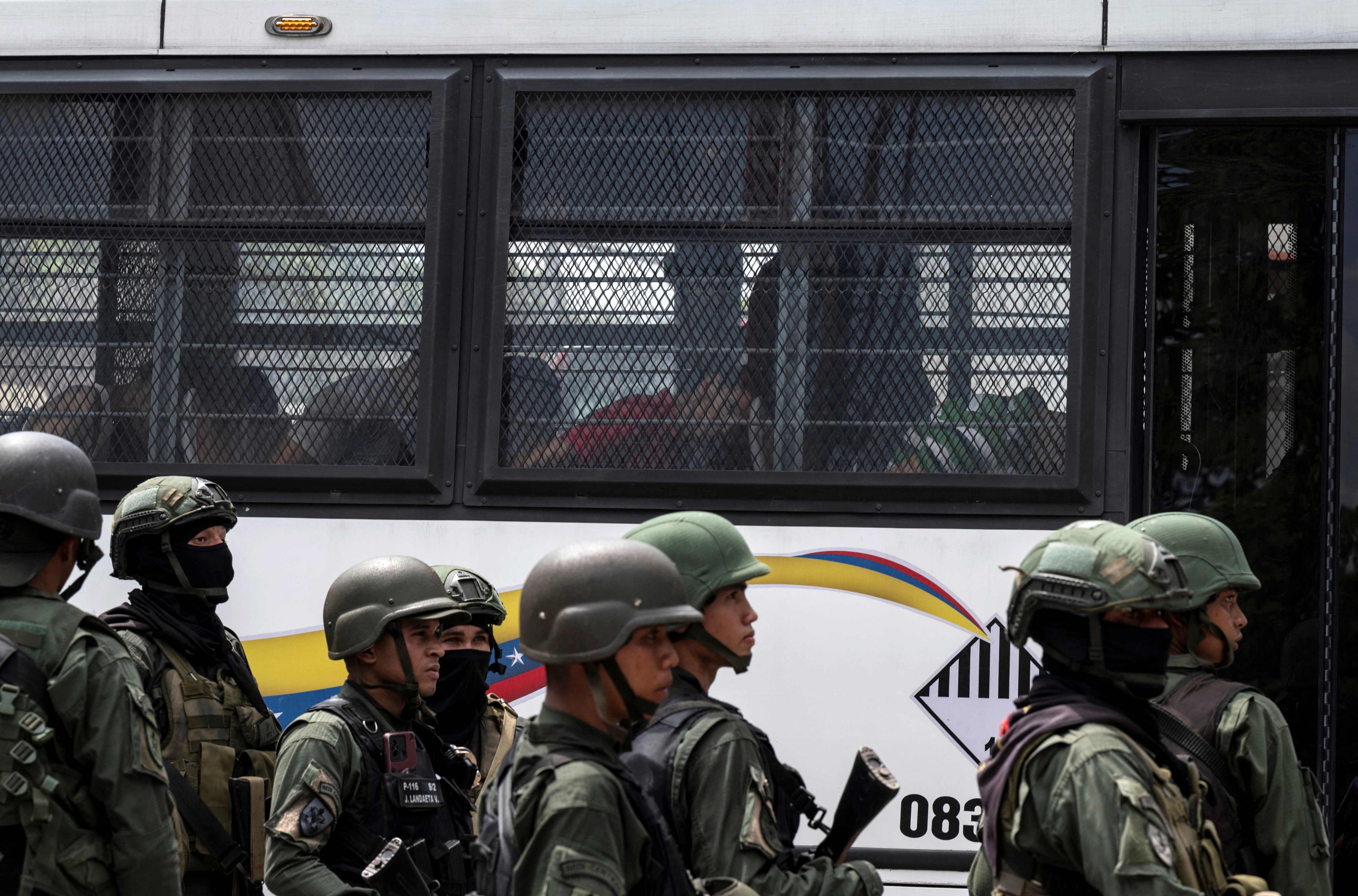 Inmates aboard a bus were transferred  from the prison to other facilities. Photo: AFP