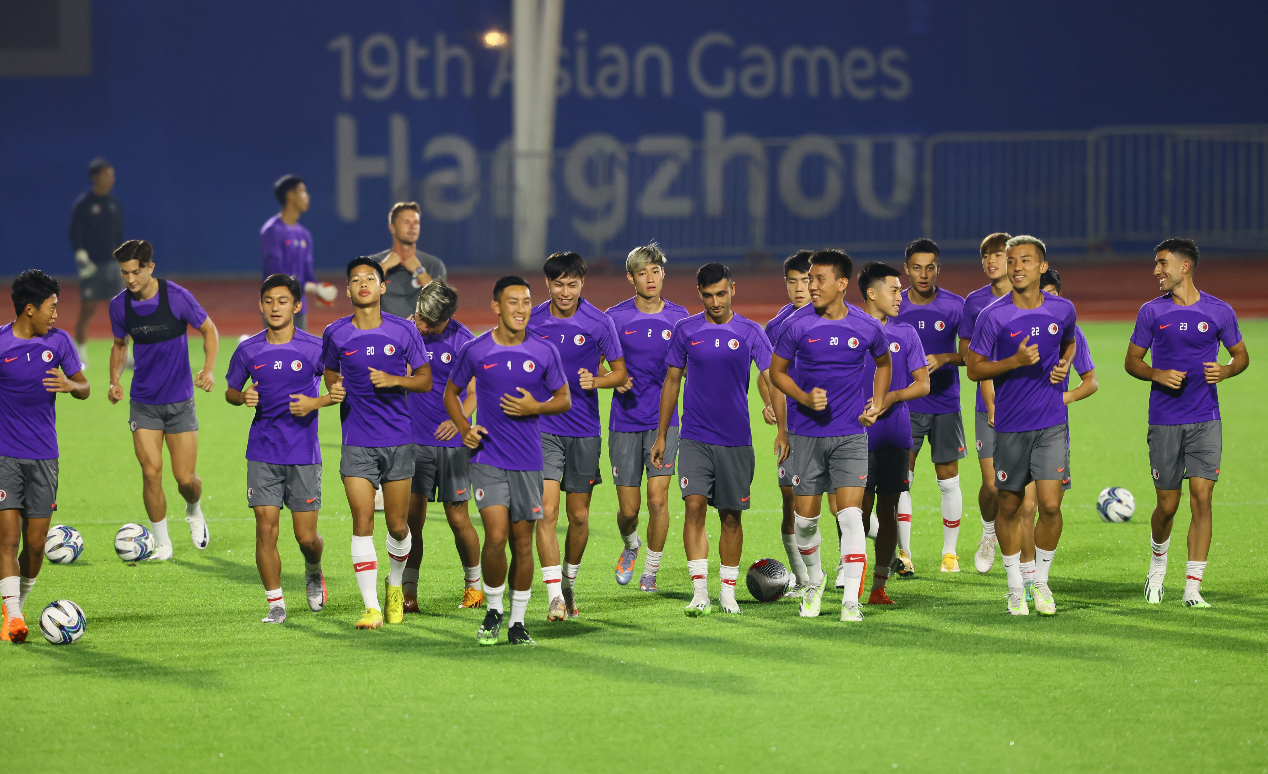 Hong Kong’s players warm-up before a training session at Huanglong Sports Centre Stadium, Hangzhou. Photo: Dickson Lee