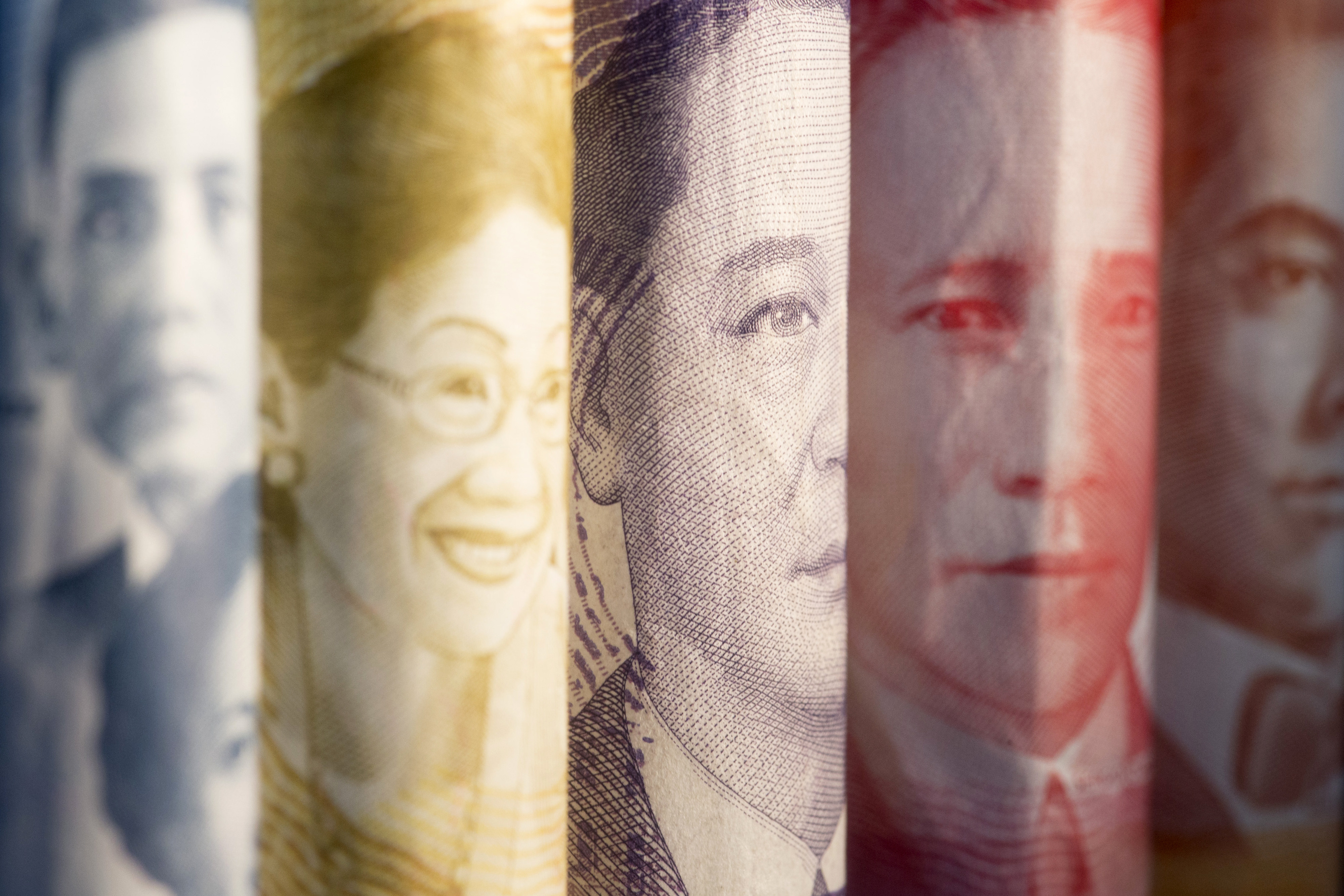 The portraits of former Philippines’ Acting President José Abad Santos, from left, and former Philippines’ Presidents Corazon Aquino, Manuel A. Roxas, Sergio Osmena and Manuel L. Quezon are displayed on 1000, 500, 100, 50 and 20 peso banknotes respectively in an arranged photograph in Bangkok, Thailand. Photo: Bloomberg