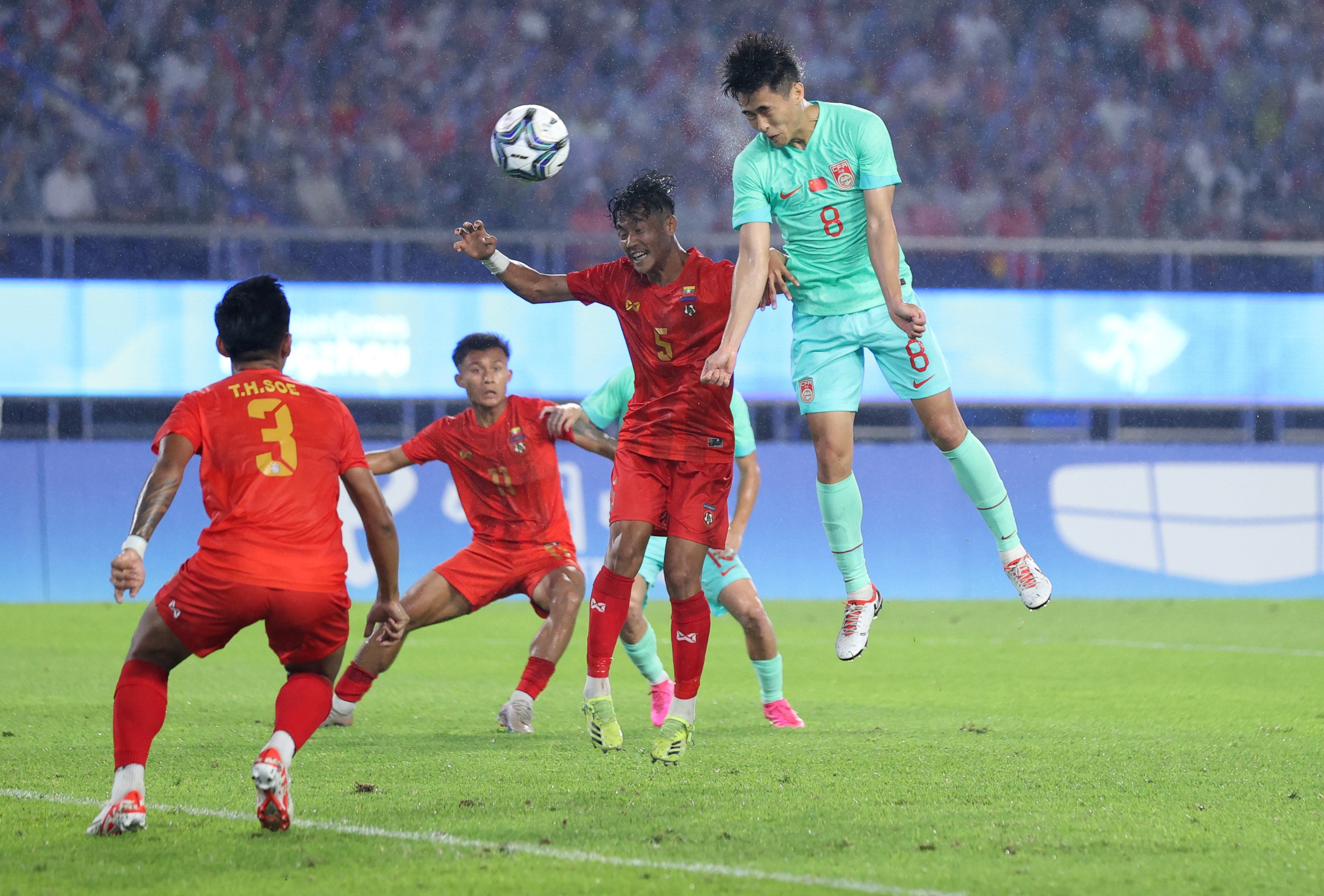 China’s Dai Wai-tsun powers a header towards the goal to score his side’s fourth against Myanmar. Photo: Xinhua