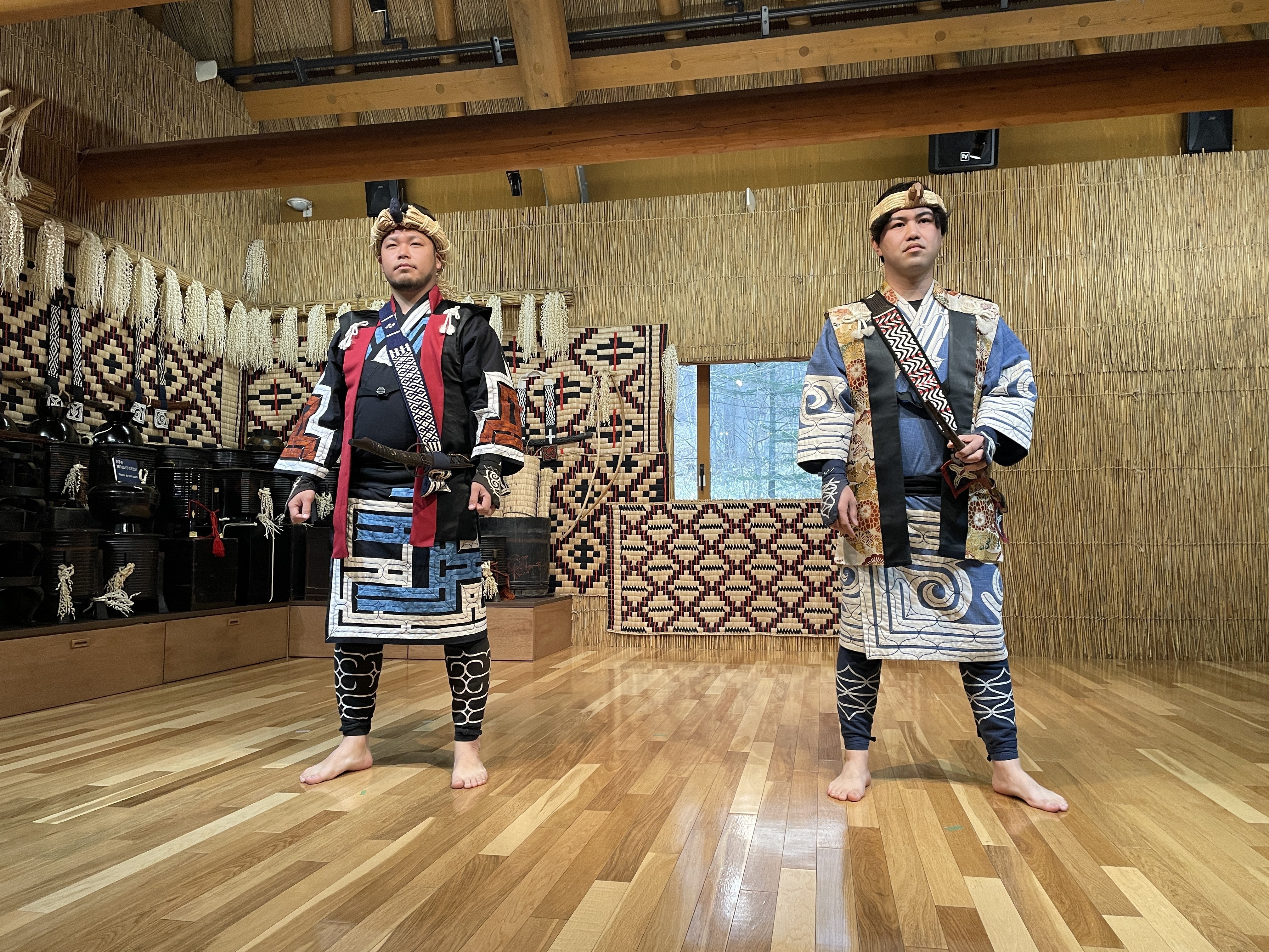 Two boys, wearing traditional clothes, pose at Upopoy National Ainu Museum and Park in Hokkaido, Japan. Photo: Getty Images