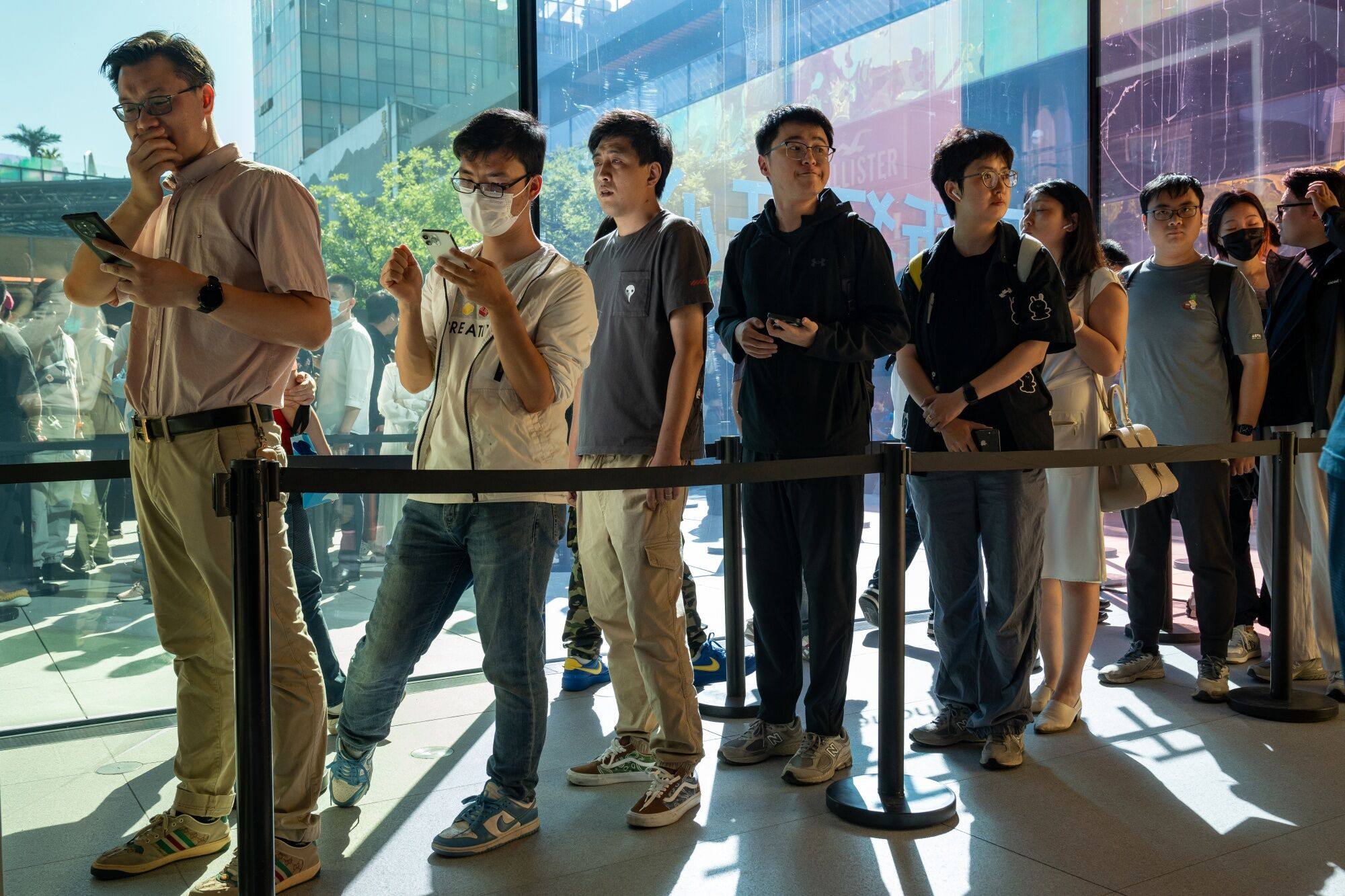 Customers queue at an Apple store in Beijing on Friday, the first day of sale of the iPhone 15. Photo: Bloomberg