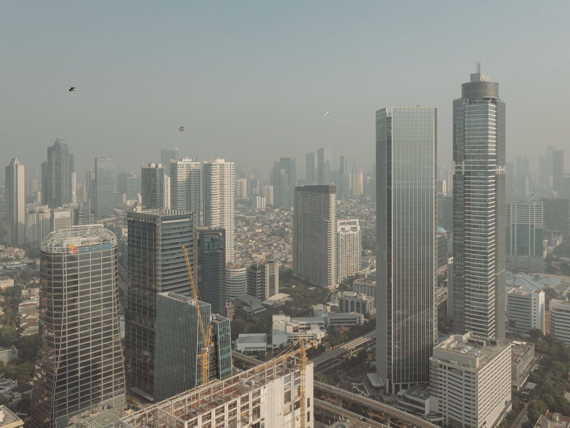 Buildings seen shrouded in smog in Jakarta last month. Indonesia’s capital is one of the fastest-growing hubs in the Asia-Pacific for energy hungry data centres. Photo: Bloomberg