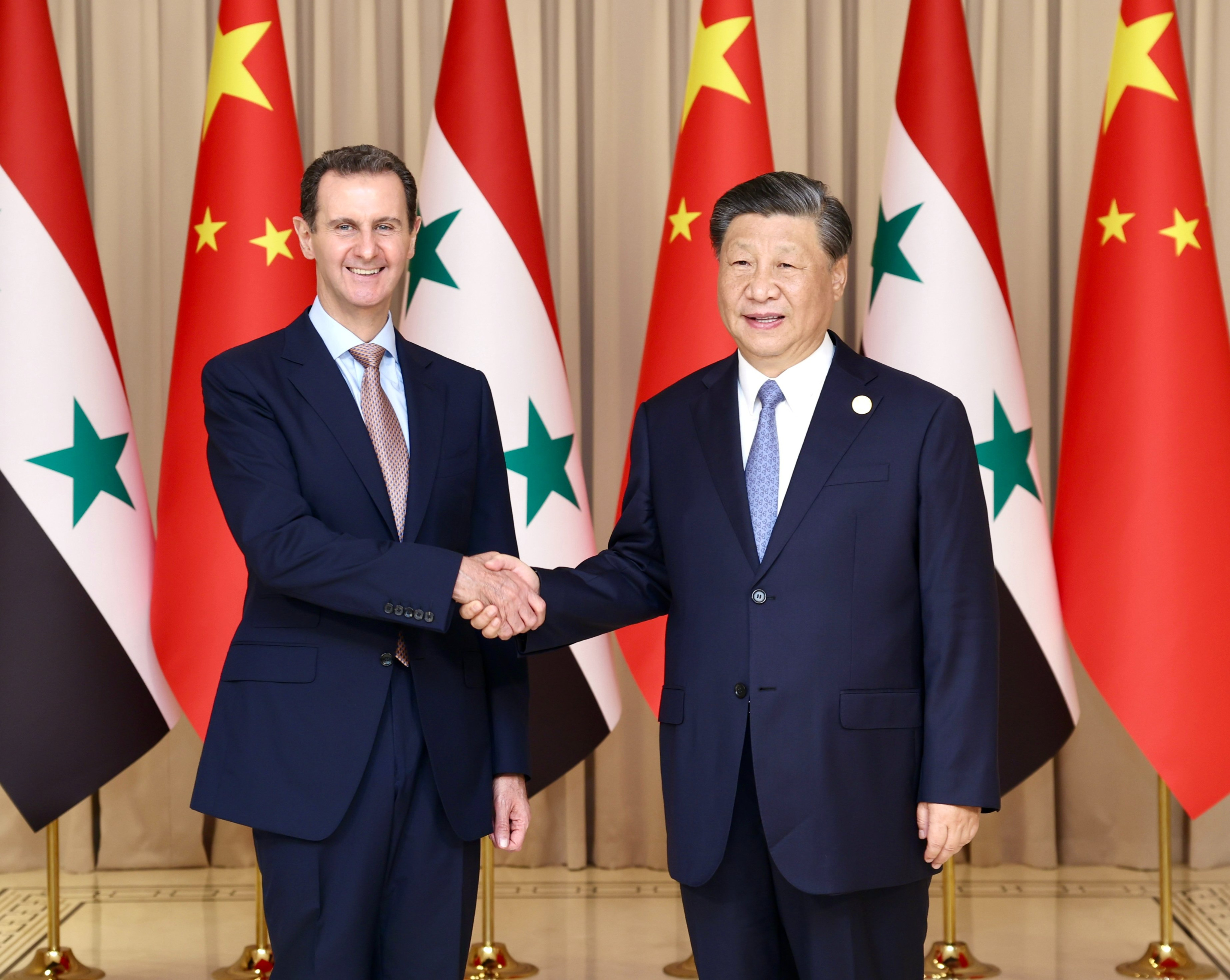 China is the third non-Arab country to be visited by Syrian President Bashar al-Assad (left), shown here shaking hands with Chinese President Xi Jinping in Hangzhou. Photo: Twitter / Hua Chunying