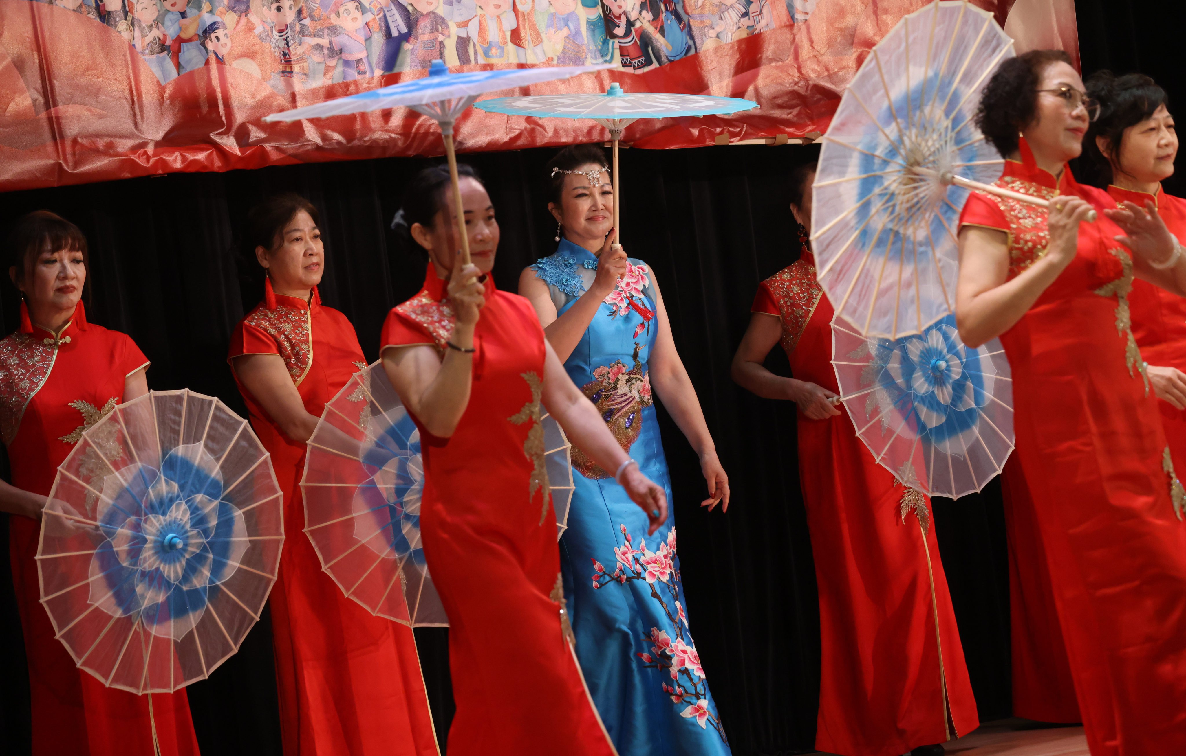 Women wear cheongsam while performing during an event at the Sai Ying Pun Community Complex in Hong Kong on April 10, 2023. Photo: May Tse