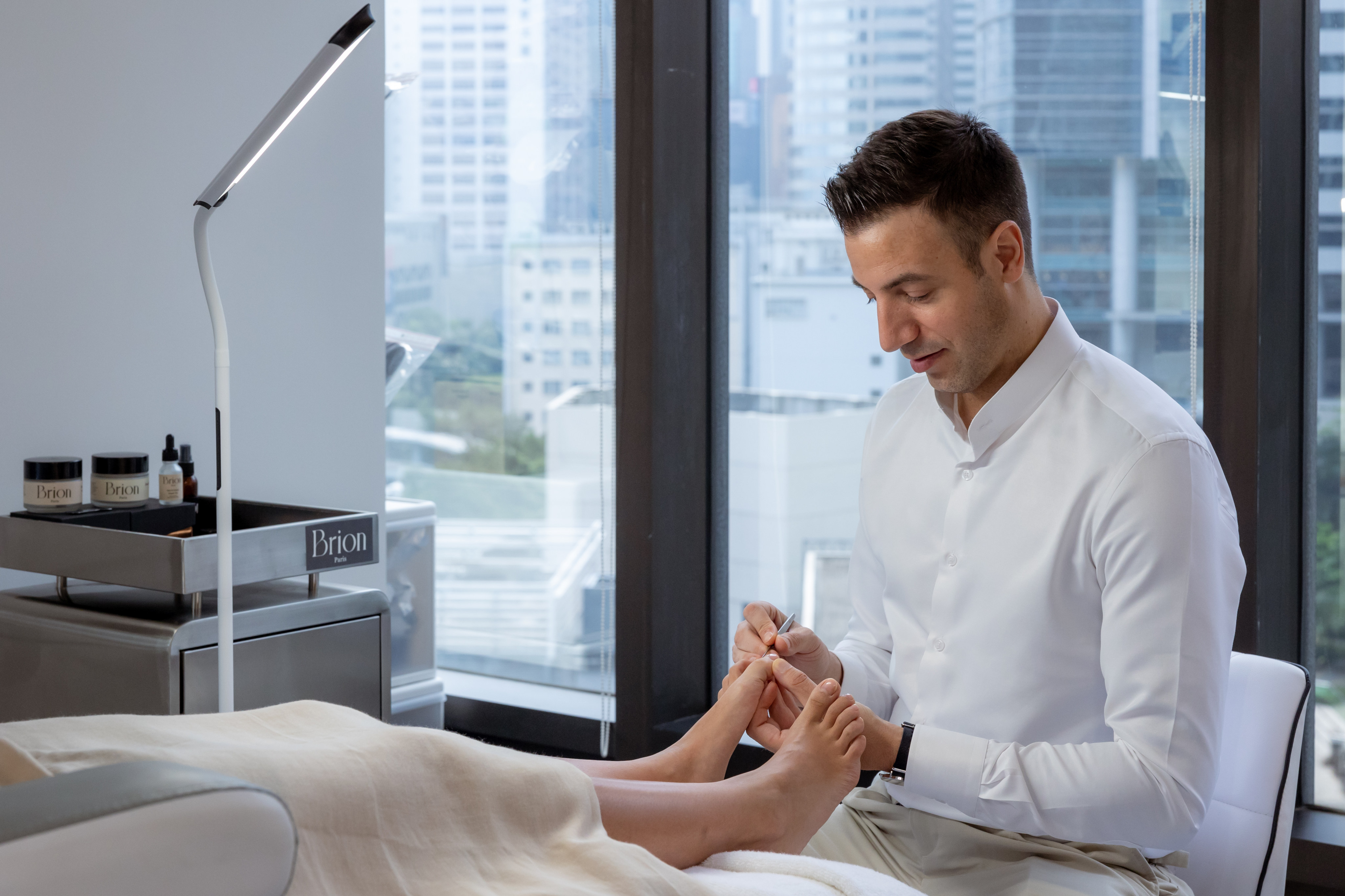 Footballer-turned-podiatrist Albin Brion treats clients at his newly opened Foot Atelier in Hong Kong. Photo: Handout