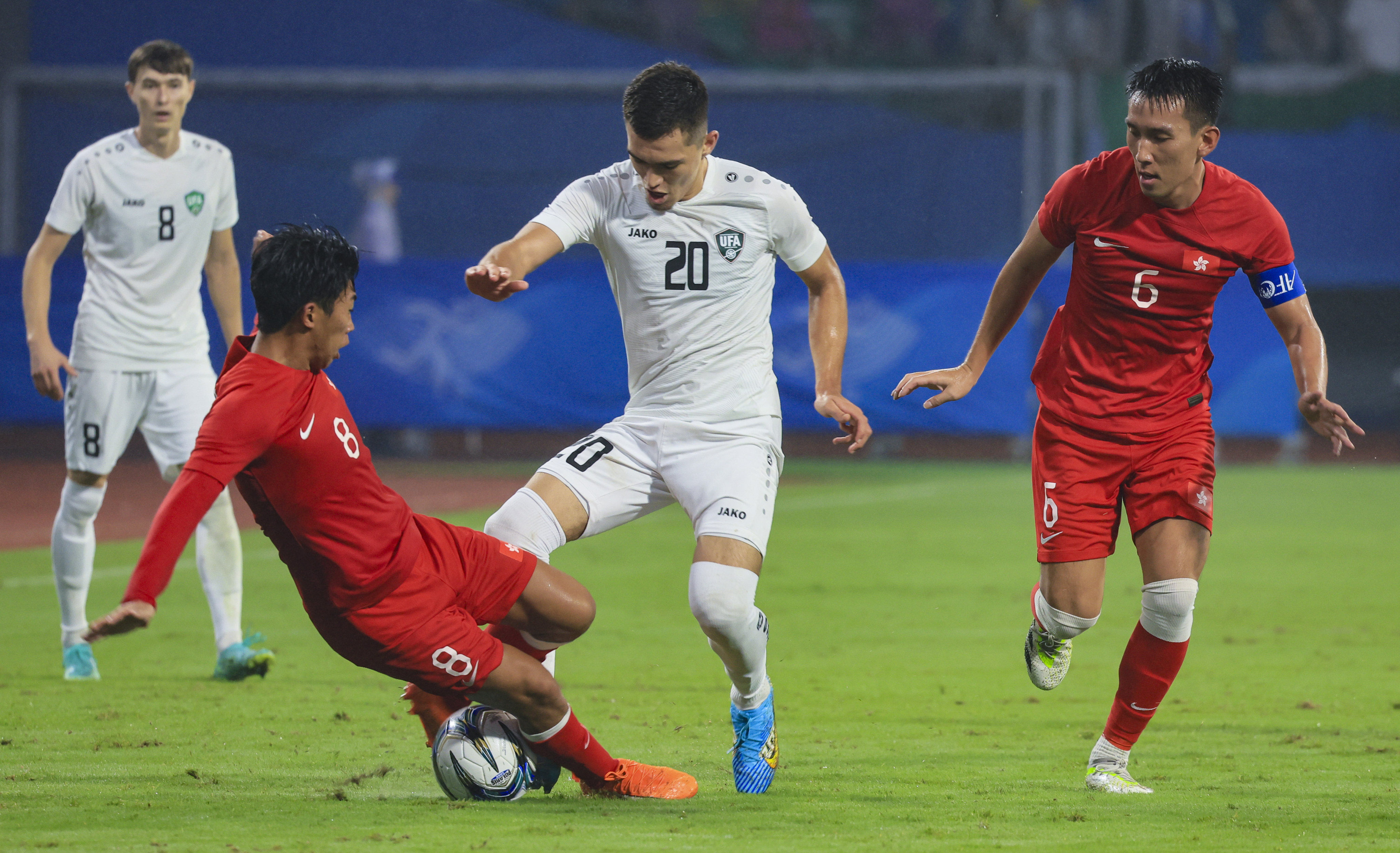 Hong Kong (in red) battle to stay in the contest before Uzbekistan claimed the only goal. Photo: Dickson Lee