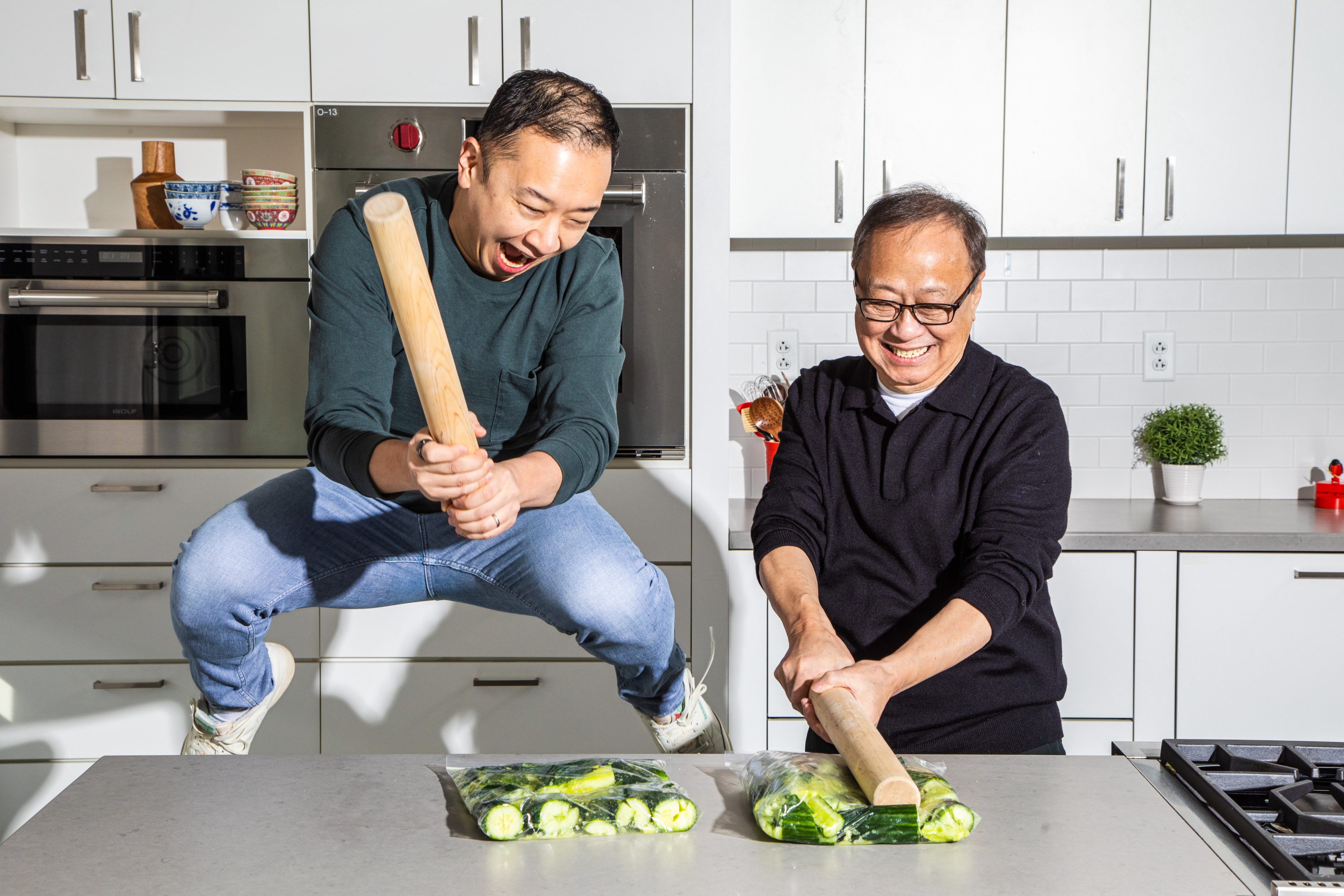 Kevin and Jeffrey Pang having fun  smashing cucumbers for a classic Chinese appetiser. Photo: A Very Chinese Cookbook