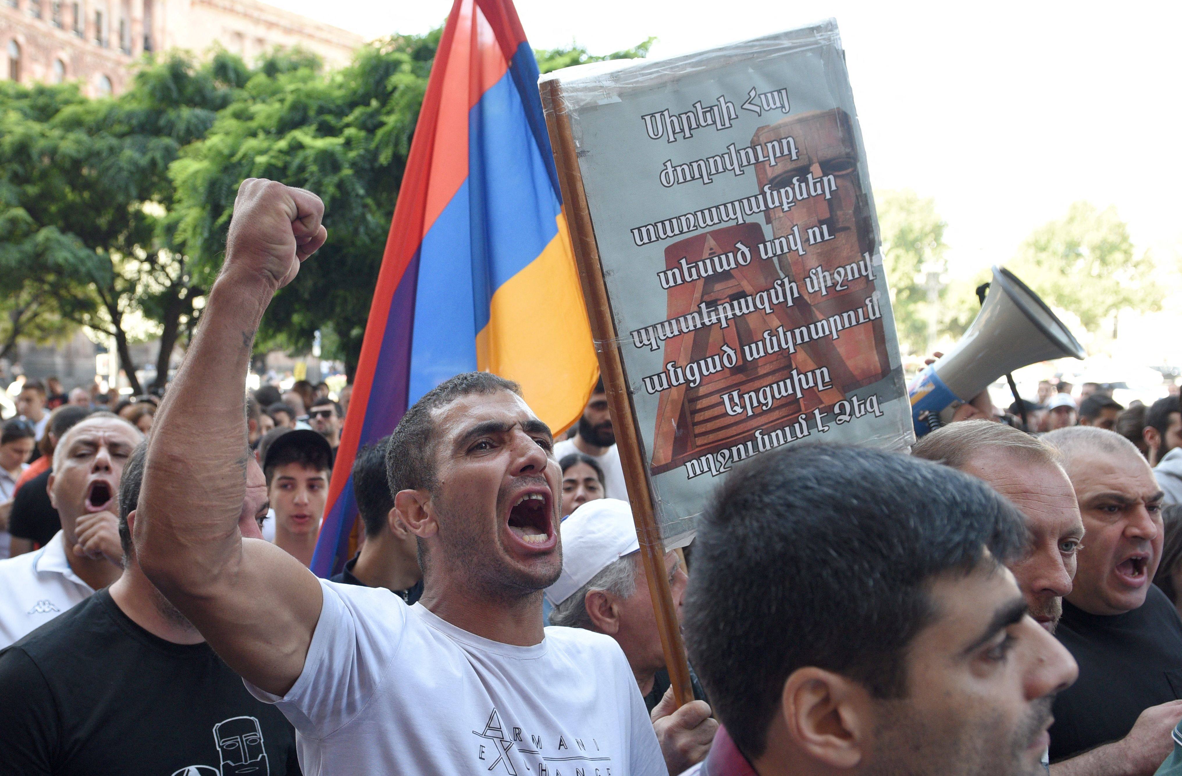 People take part in an anti-government rally in downtown Yerevan in Armenia on Friday, following Azerbaijani military operations against Armenian separatist forces in Nagorno-Karabakh. Photo: AFP