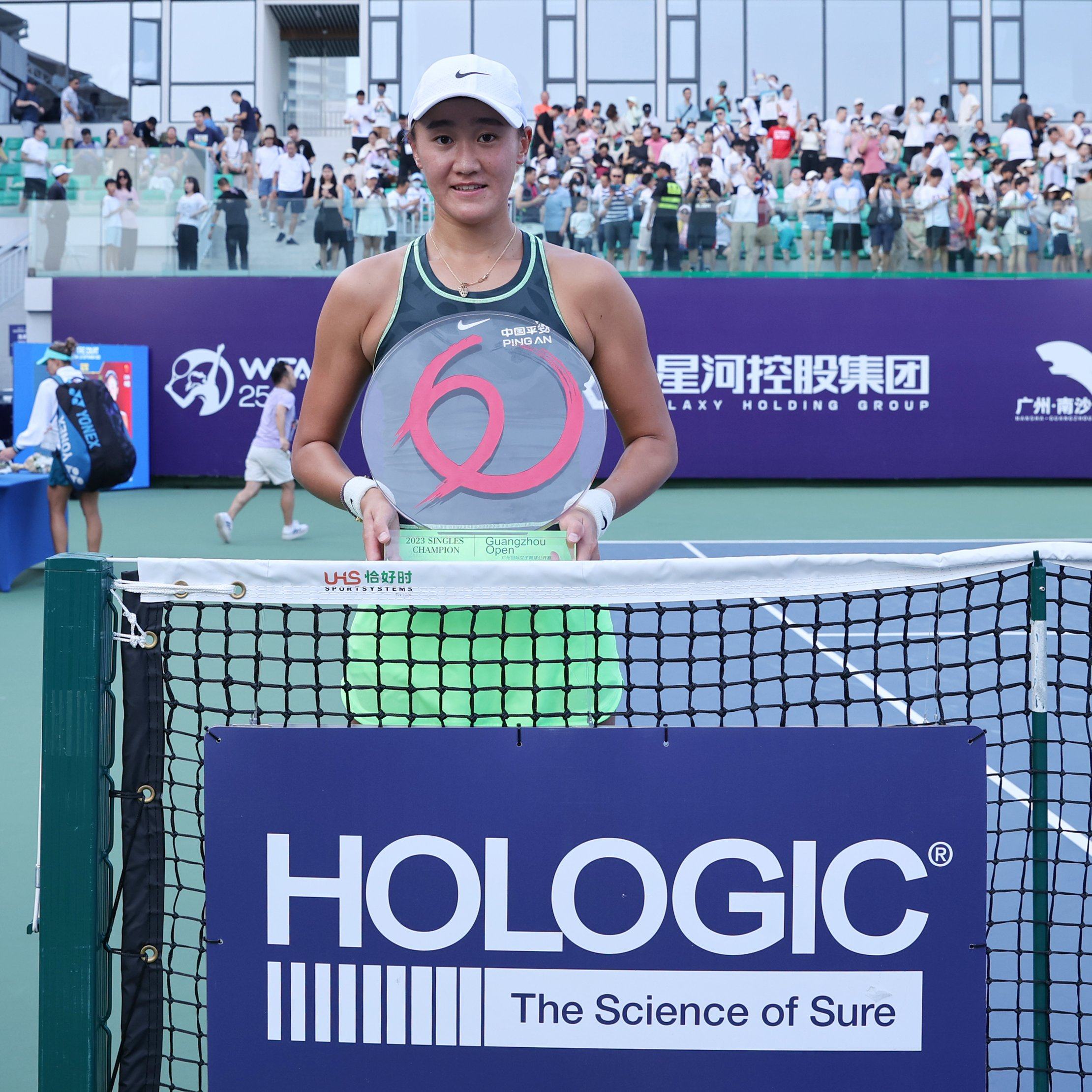 Wang Xiyu holds her first WTA Tour trophy after winning on home soil in Guangzhou. Photo: WTA
