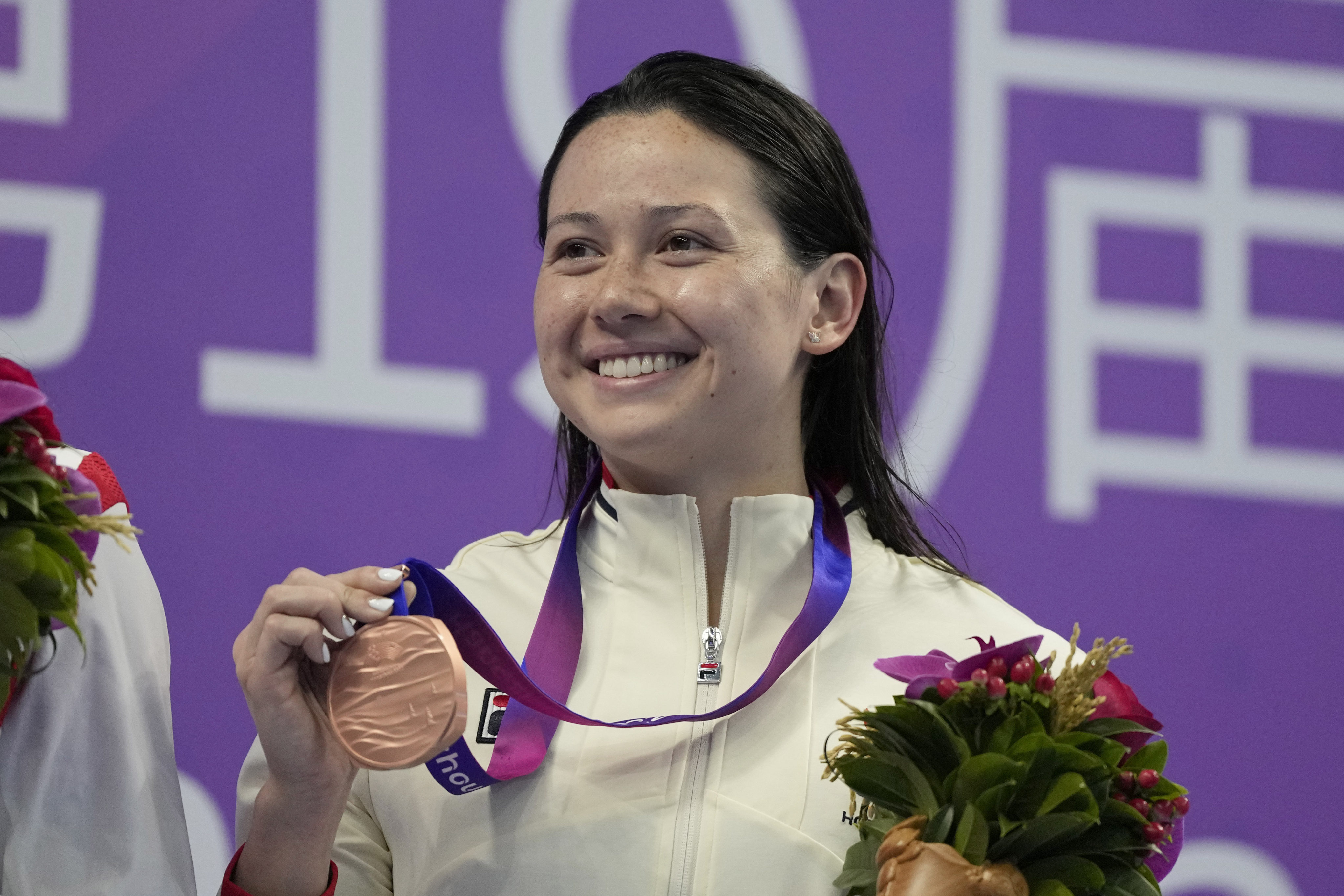 Hong Kong’s Siobhan Haughey celebrates her bronze medal in the  women’s 50m breaststroke final at the 2023 Asian Games in Hangzhou. Photo: AP
