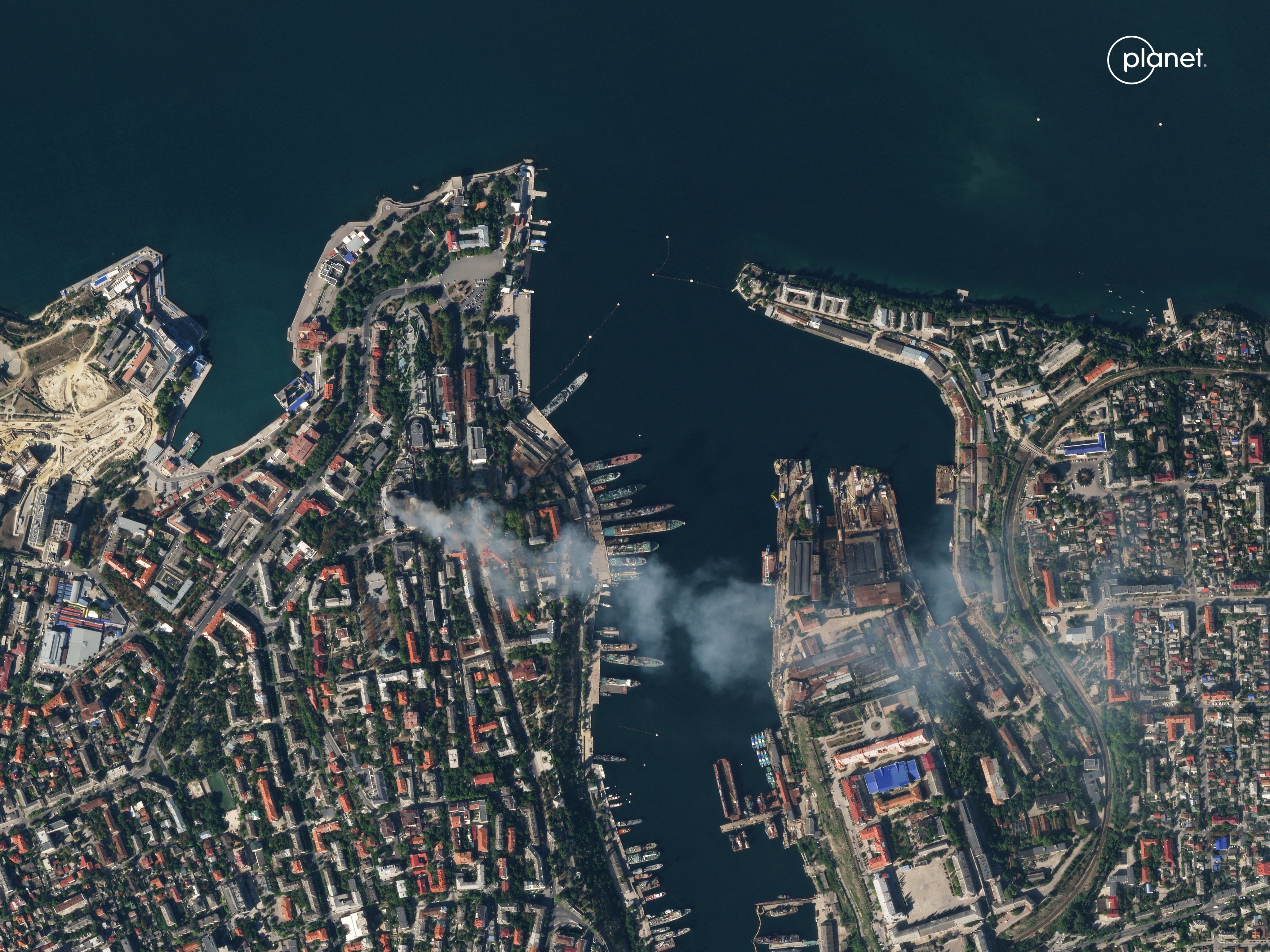 A satellite image shows smoke billowing from a Russian Black Sea Navy HQ after a missile strike, as Russia’s invasion of Ukraine continues. Photo: Reuters