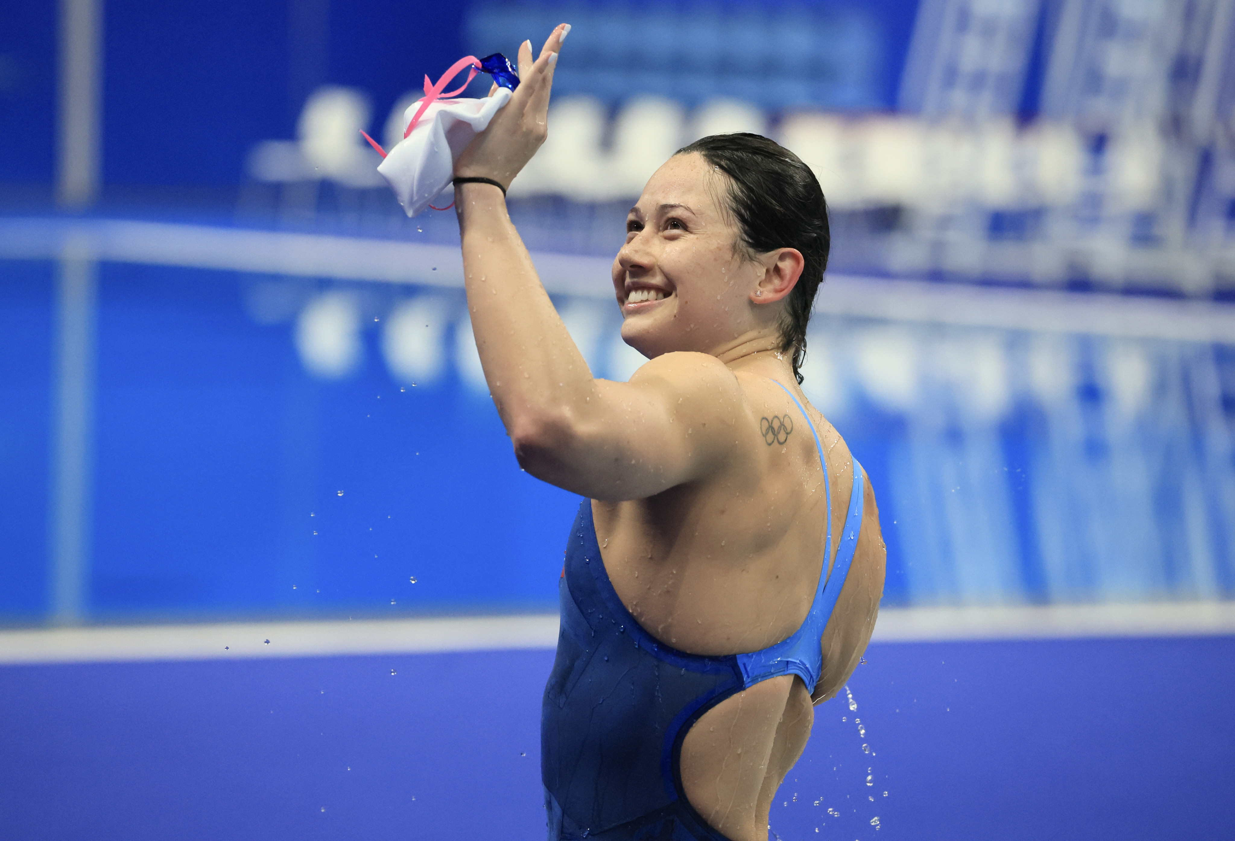 Siobhan Haughey waves to her parents after winning the 200m freestyle at the Asian Games. Photo: Dickson Lee