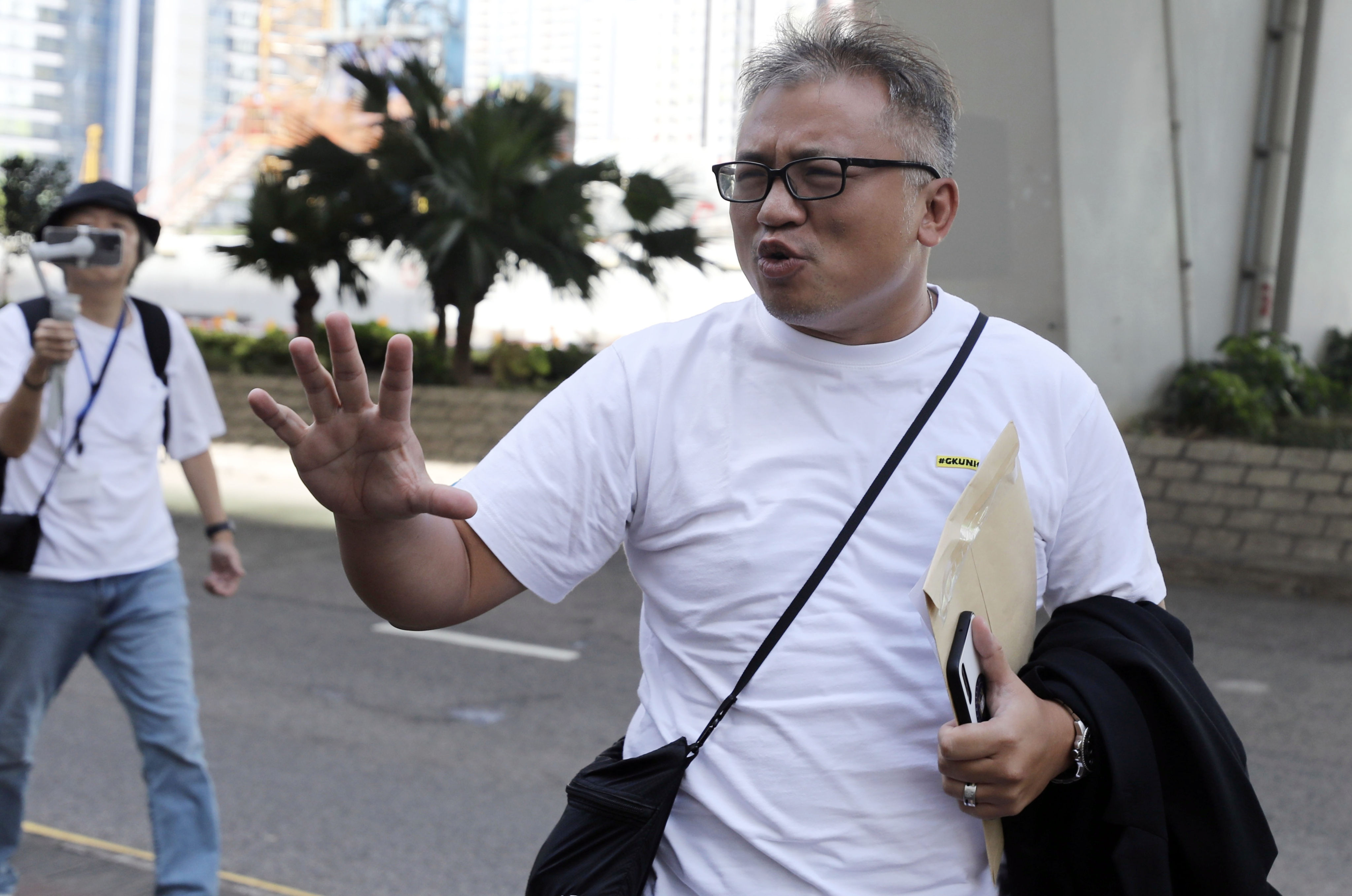 Veteran journalist Ronson Chan arrives outside the West Kowloon Court on Monday. Photo: Xiaomei Chen