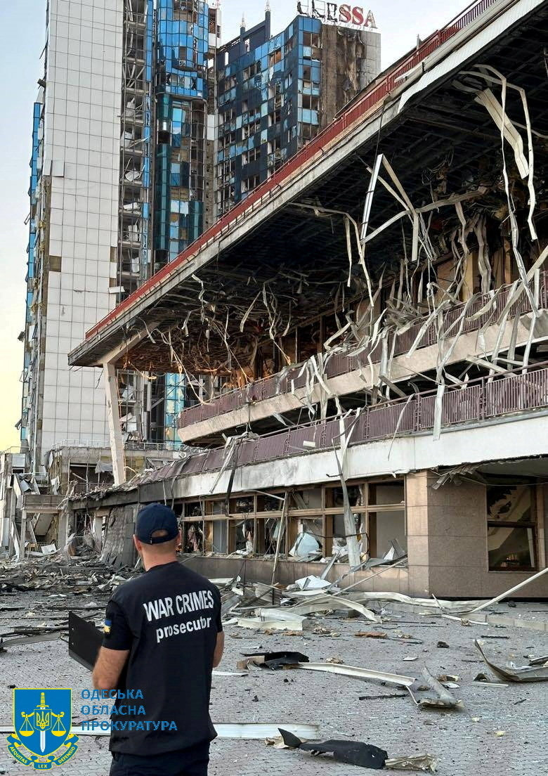 An Odesa prosecutor inspects damage following a Russian military attack. Photo: Handout via Reuters
