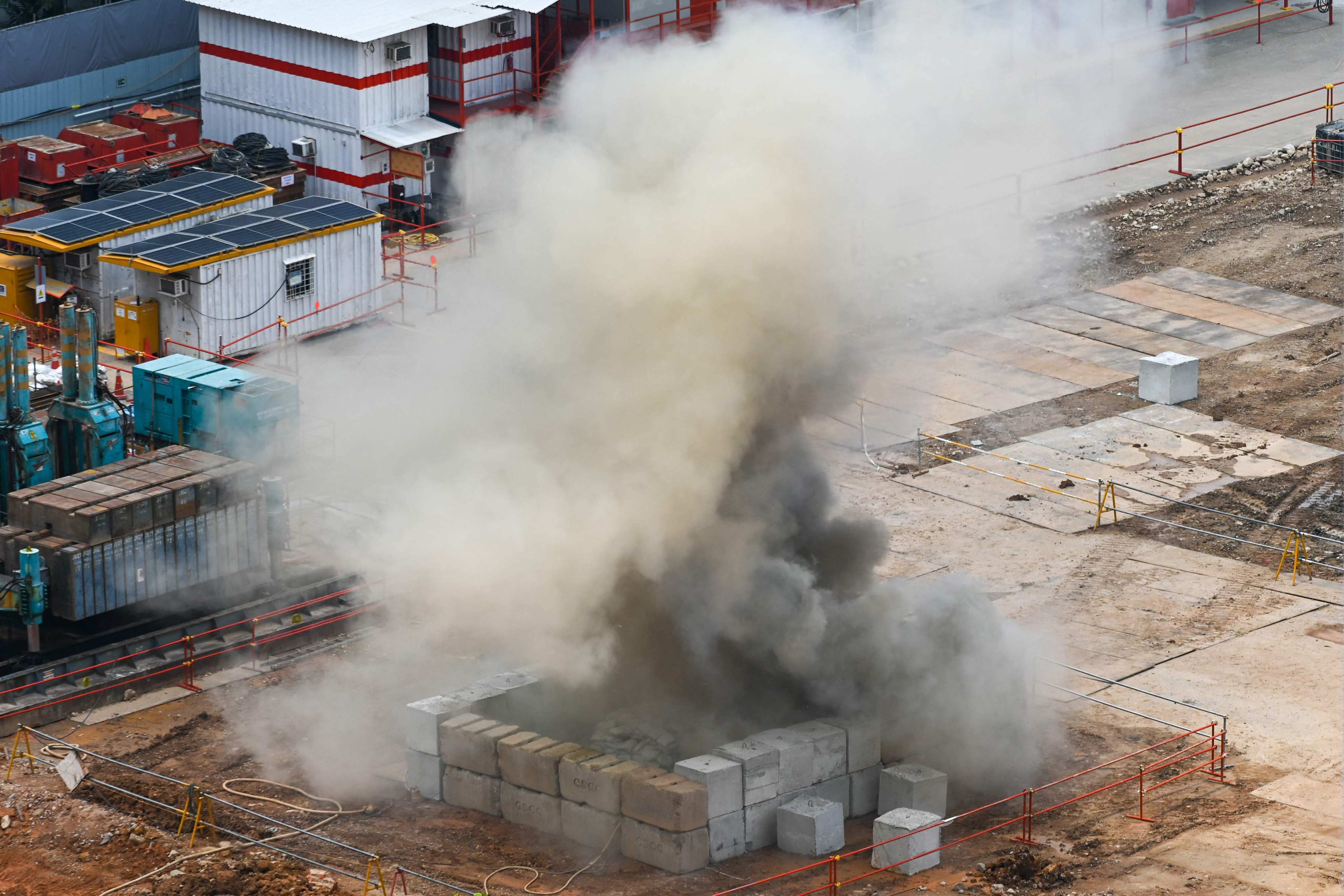 Smoke rises from a construction site in Singapore where a World War II-era aerial bomb was detonated in a controlled explosion on Tuesday. Photo: AFP