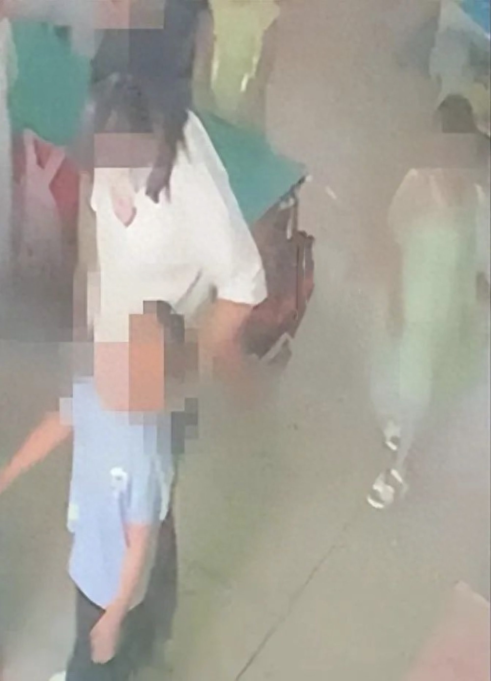 Surveillance footage from the kindergarten shows a teacher yanking a child by his hair from behind. Photo: Douyin