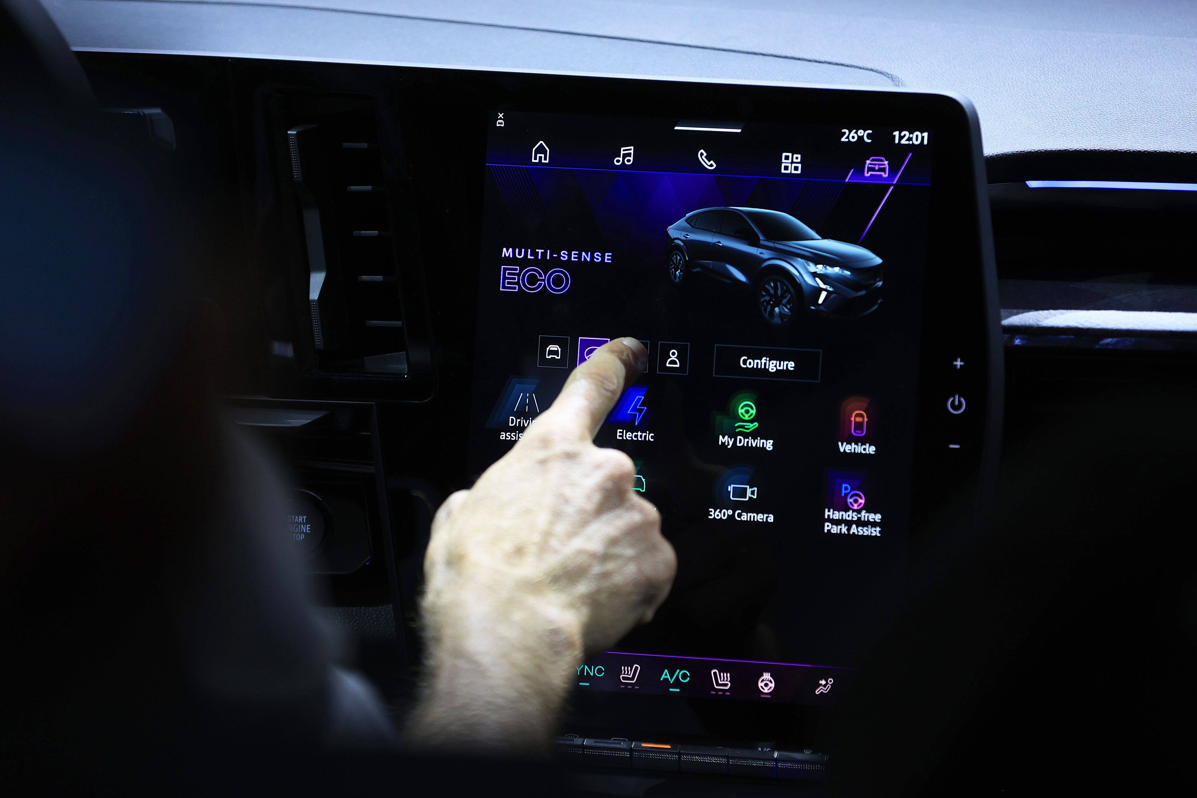 A visitor tests the touchscreen controls of a Renault Rafale electric vehicle at the Munich Motor Show in Germany, on September 5. Raising tariffs is not the way to make Europe’s EV producers more competitive. Photo: Bloomberg