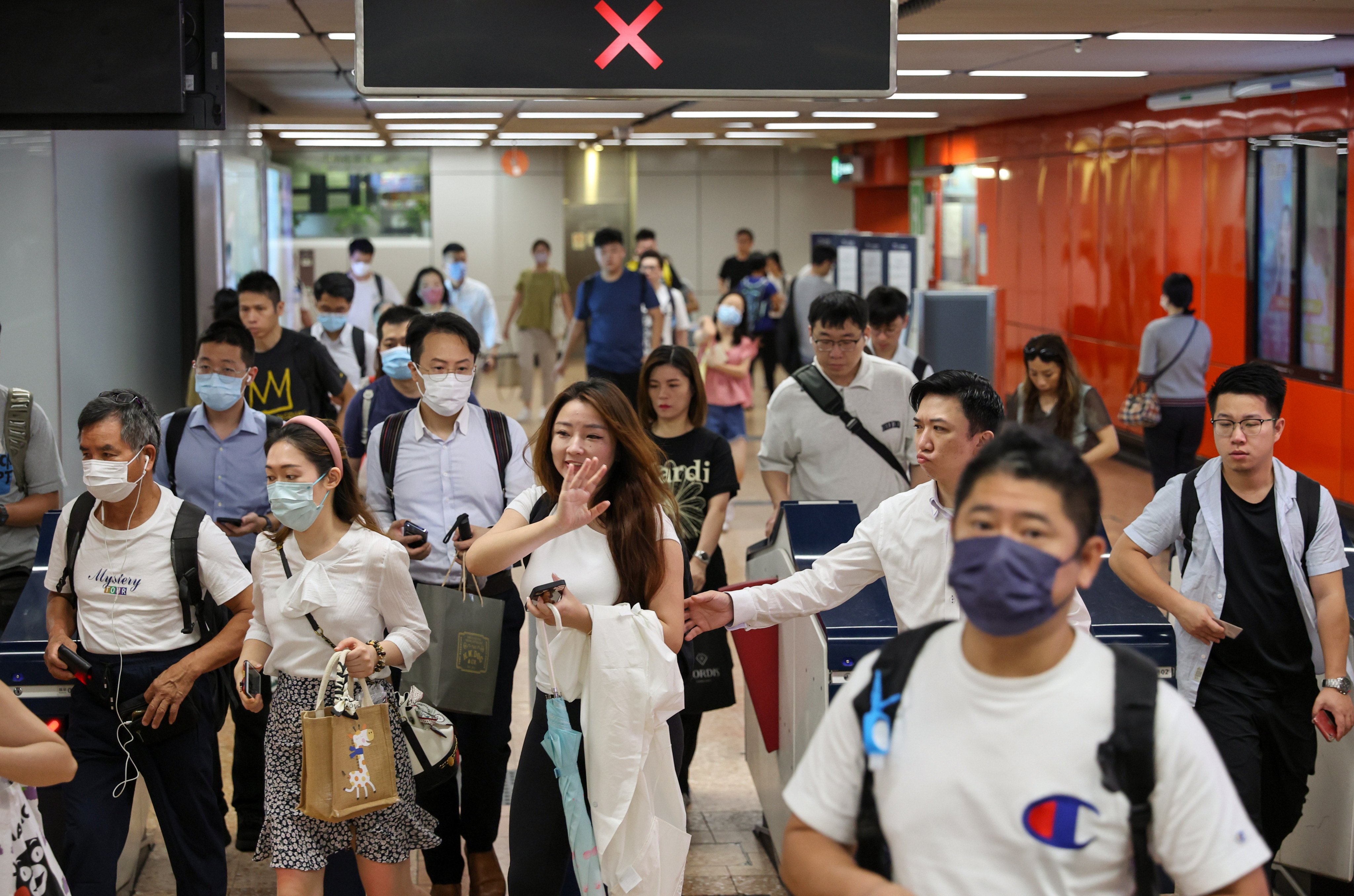 Commuters exit turnstiles at Mong Kok MTR station on June 26. Photo: Yik Yeung-man