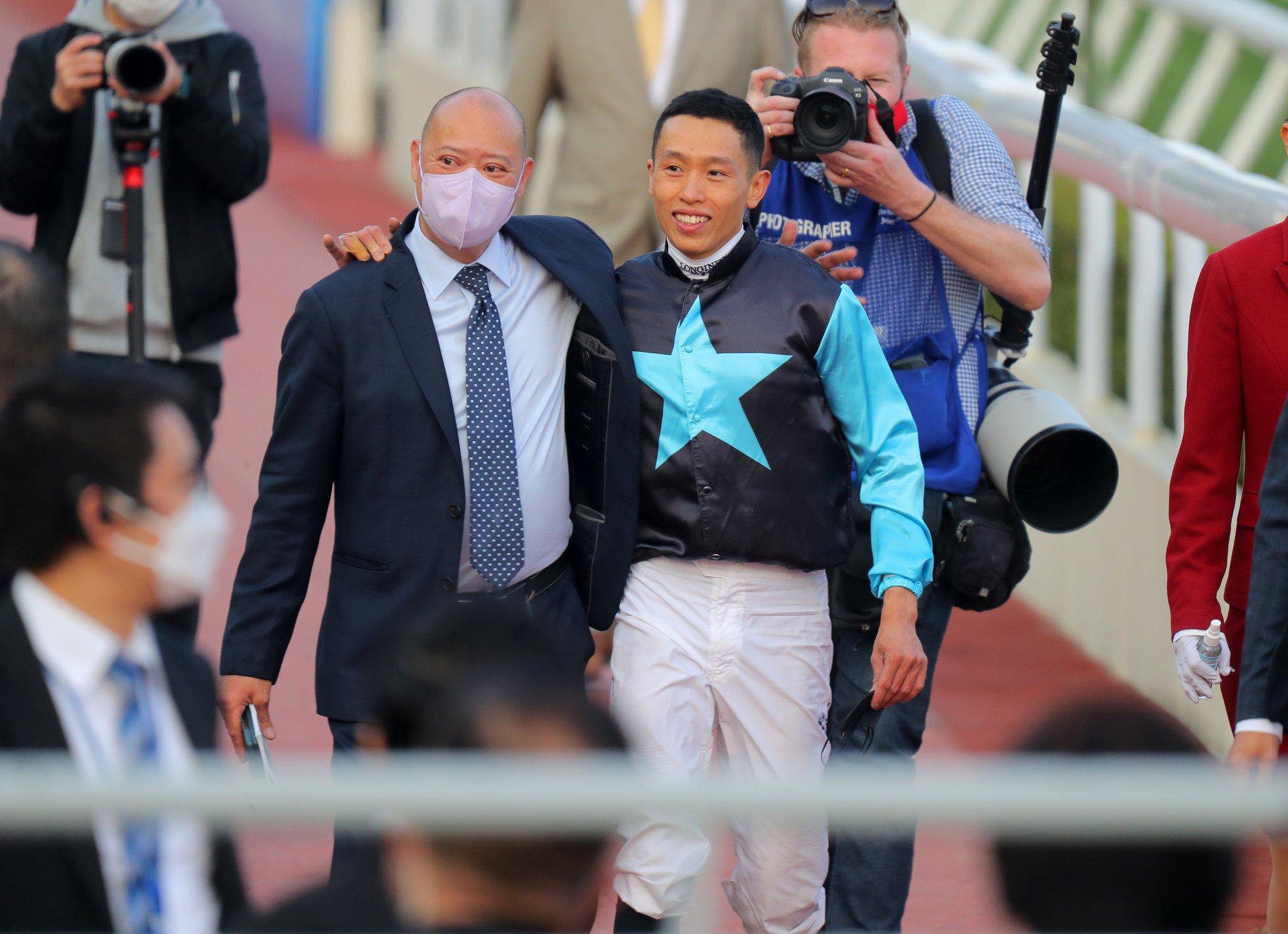 Trainer Chris So and jockey Vincent Ho soak up Super Sunny Sing’s Classic Cup success.