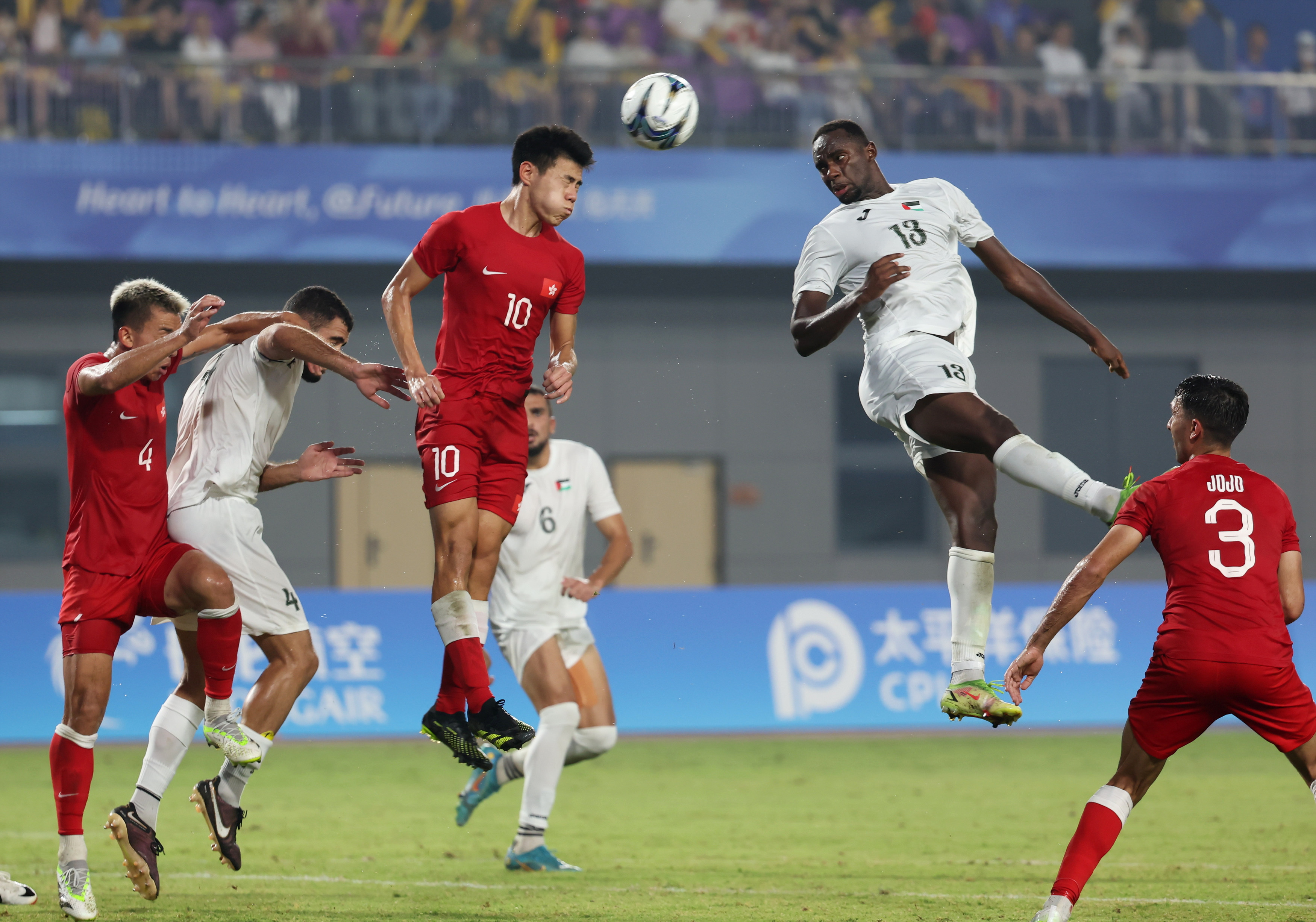 Hong Kong and Palestine battle for the ball. Photo: Asian Games