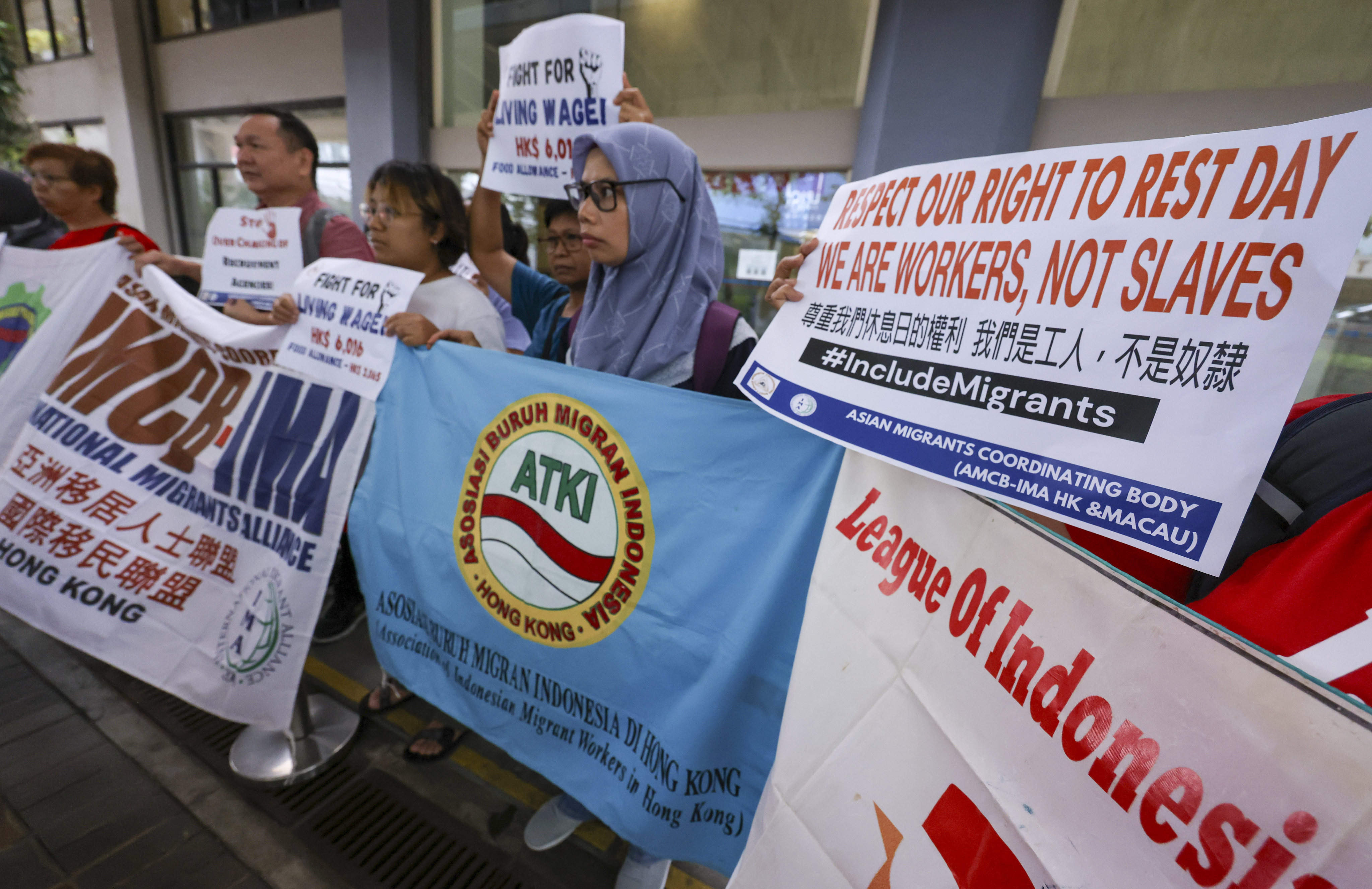 Members of the Asian Migrants Coordinating Body meet the media after talks with the Labour Department for the annual wage review consultation, in Sheung Wan on August 9. Photo: May Tse