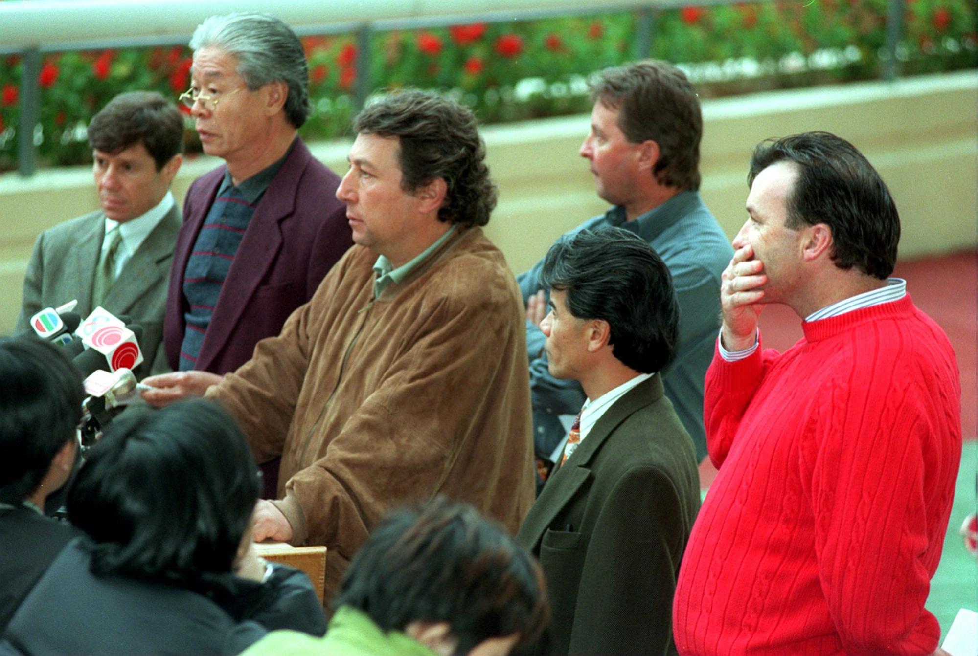 Patrick Biancone (third left) and David Hayes (right) speak at a 1999 media conference. Photo: Antony Dickson