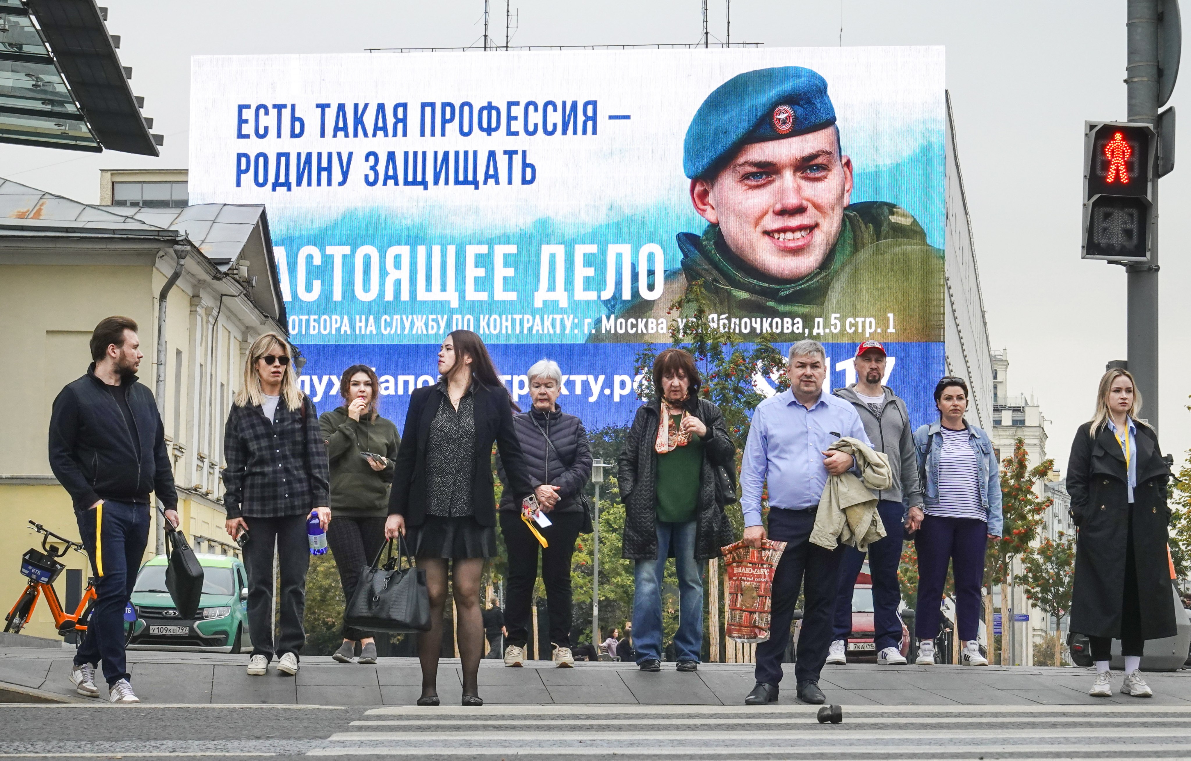 A military conscription billboard in Moscow. Russia said that it planned to raise defence spending by almost 70 per cent next year. Photo: EPA-EFE