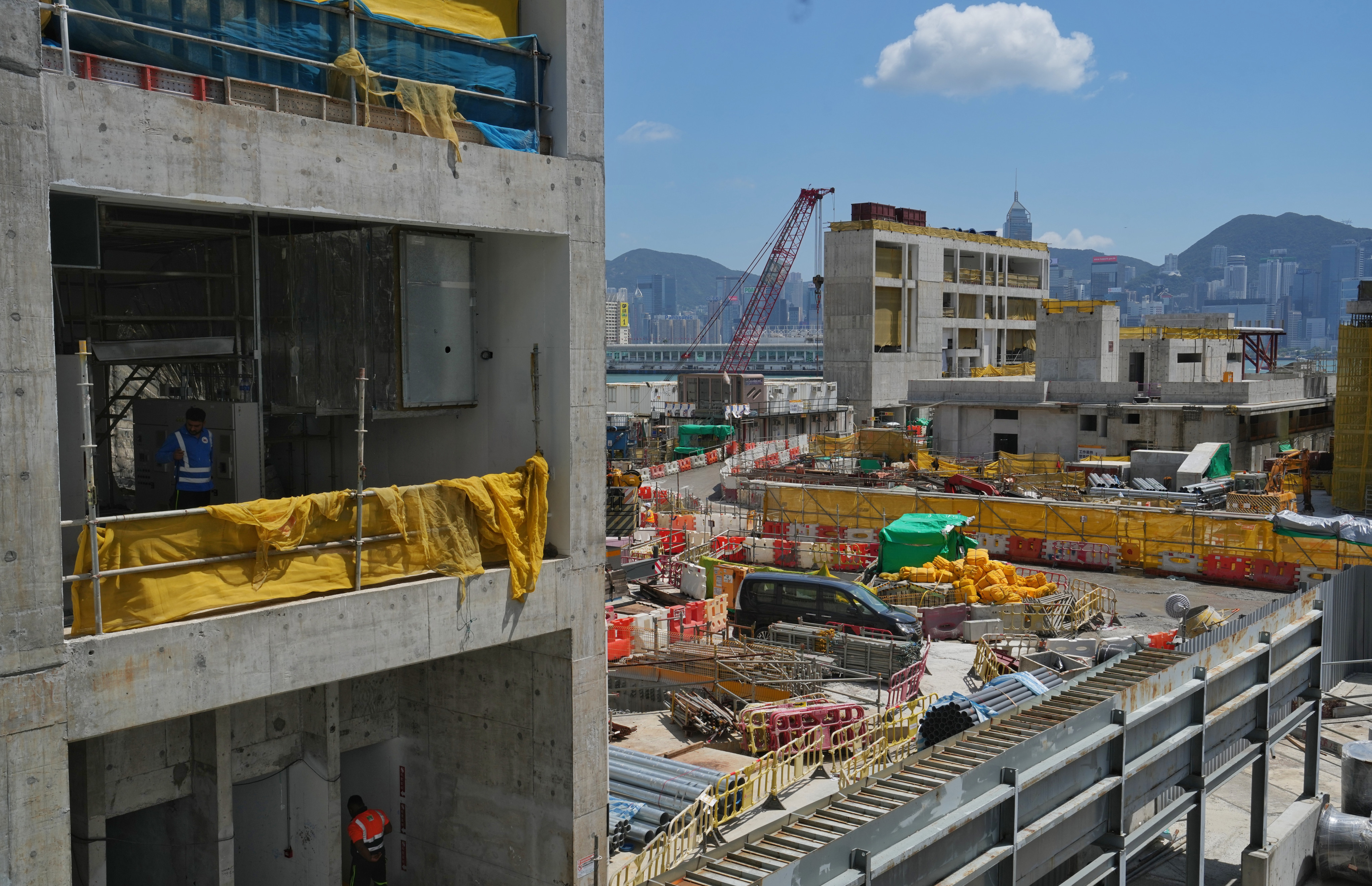 Construction workers work in the site of Hong Kong’s West Kowloon art hub. Photo: Elson LI