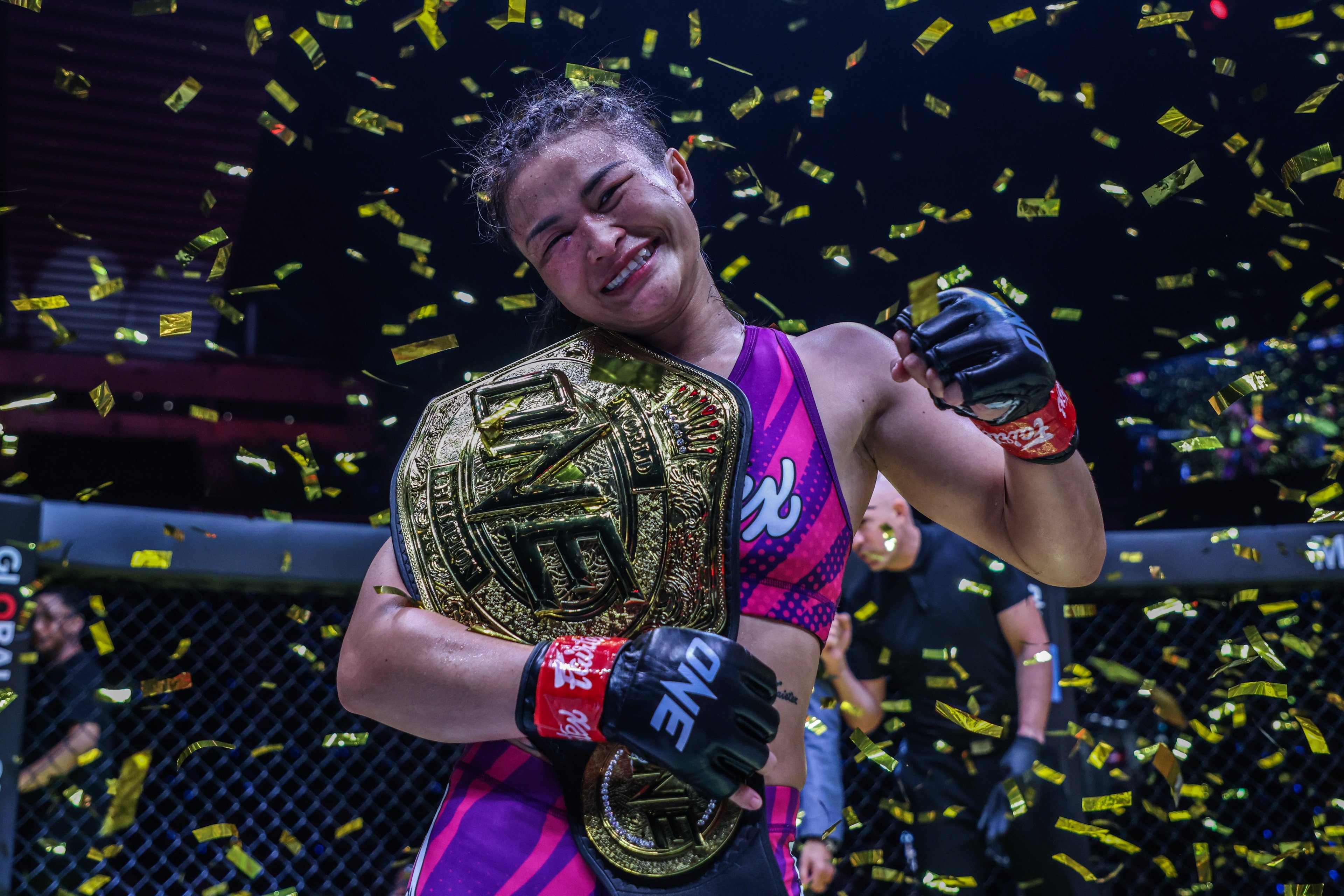 Stamp Fairtex celebrates with the ONE atomweight MMA title. Photos: ONE Championship