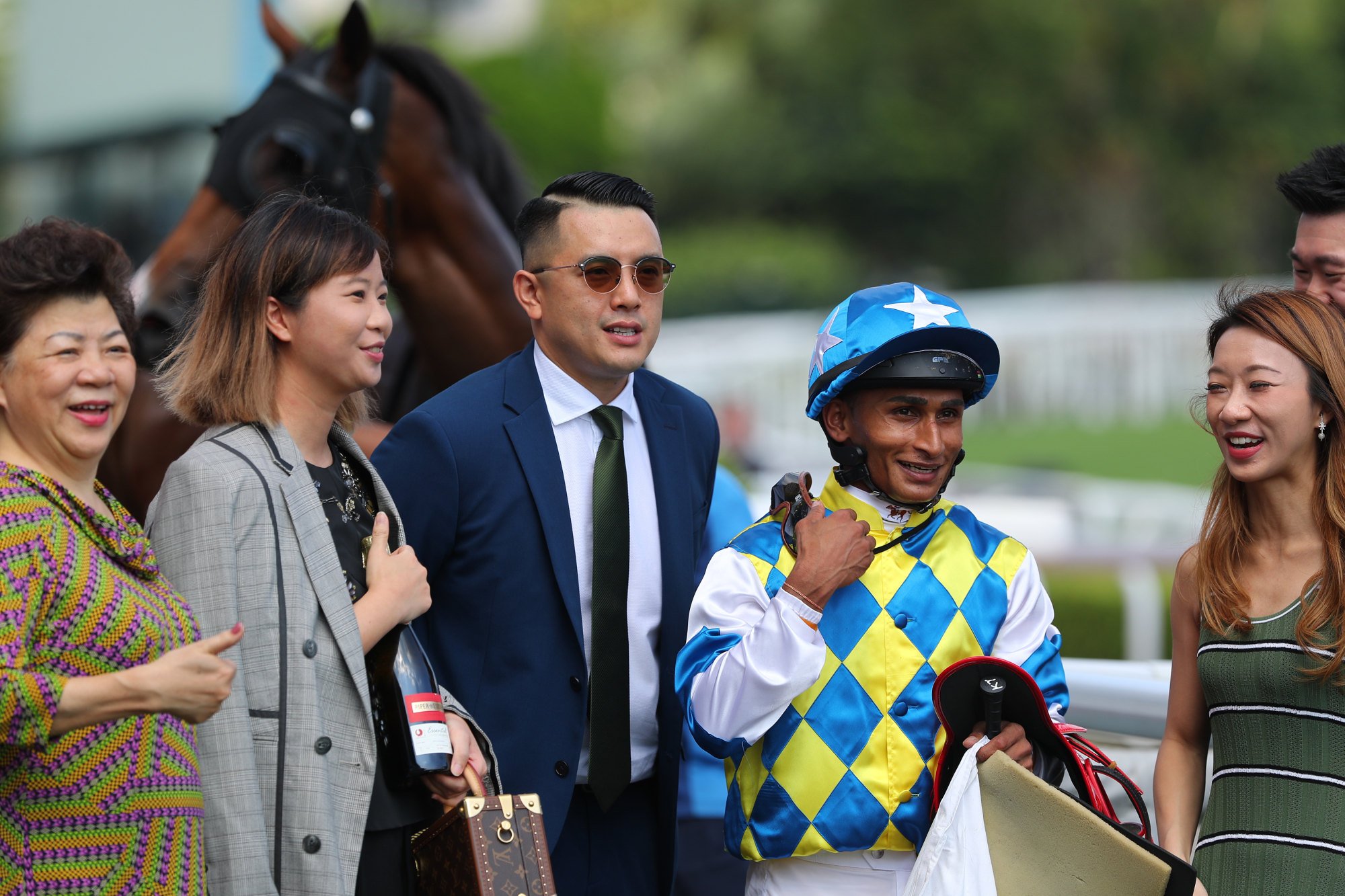 Trainer Pierre Ng and jockey Karis Teetan celebrate Galaxy Patch’s win with connections.