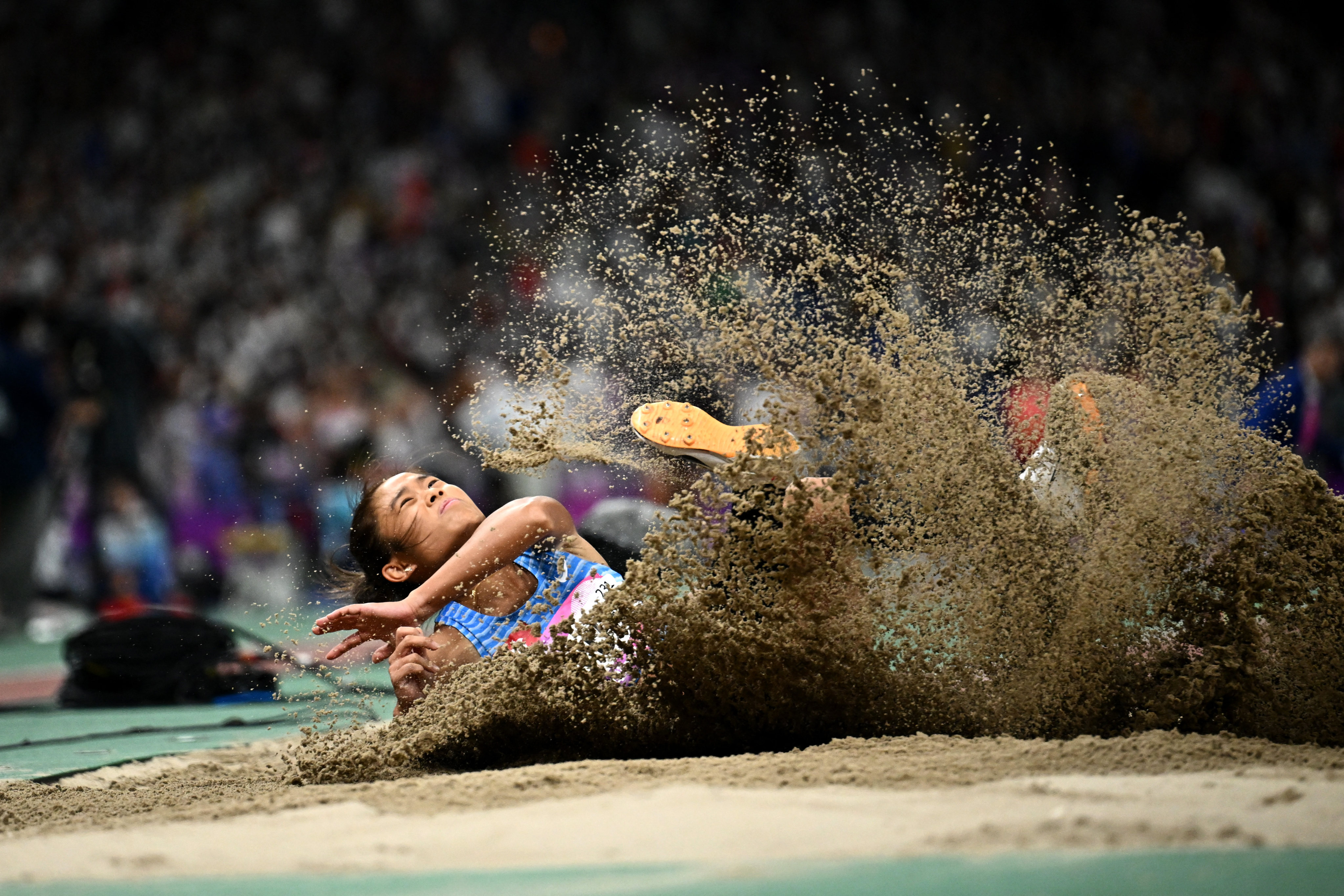 Hong Kong’s Tiffany Yue jumps into the city’s athletics record books in the long jump final. Photo: Reuters