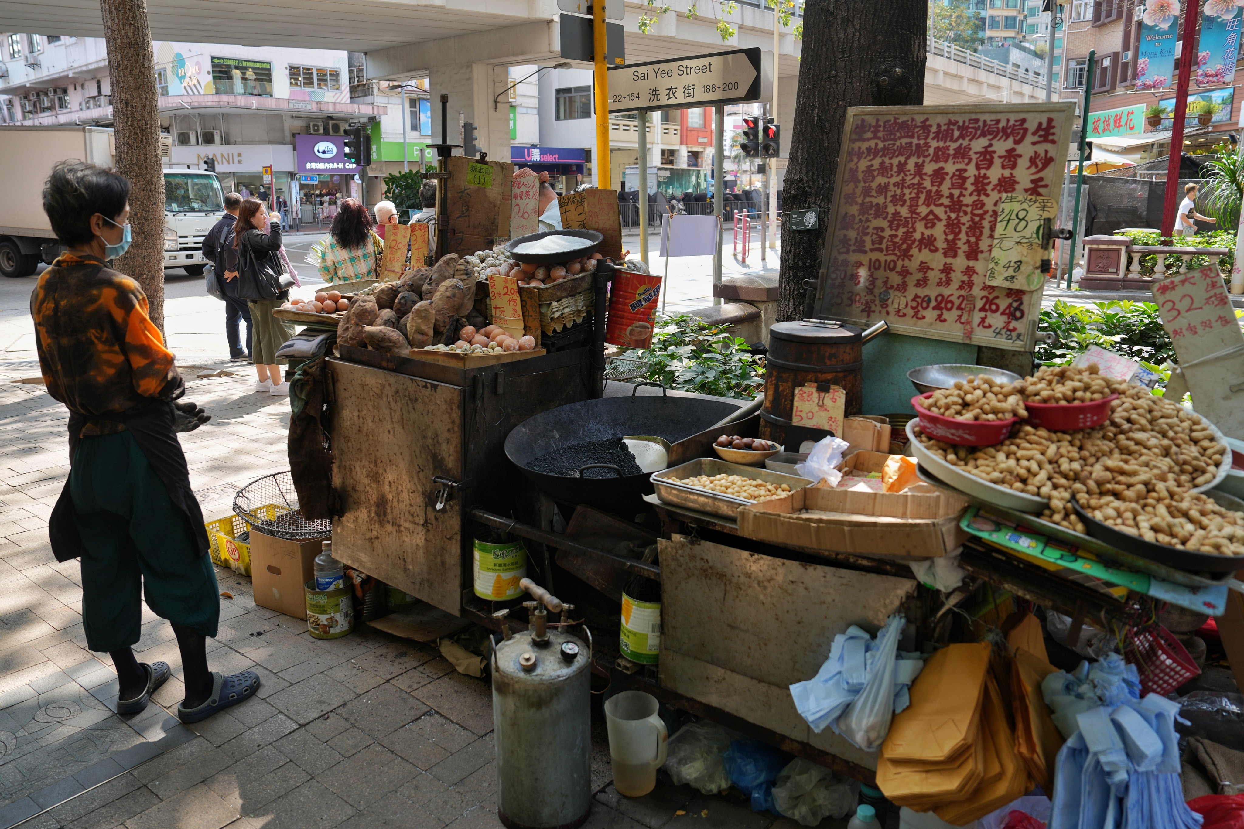 Hong Kong street hawkers sell roasted chestnuts, eggs and sweet potatoes.   Photo: Elson Li